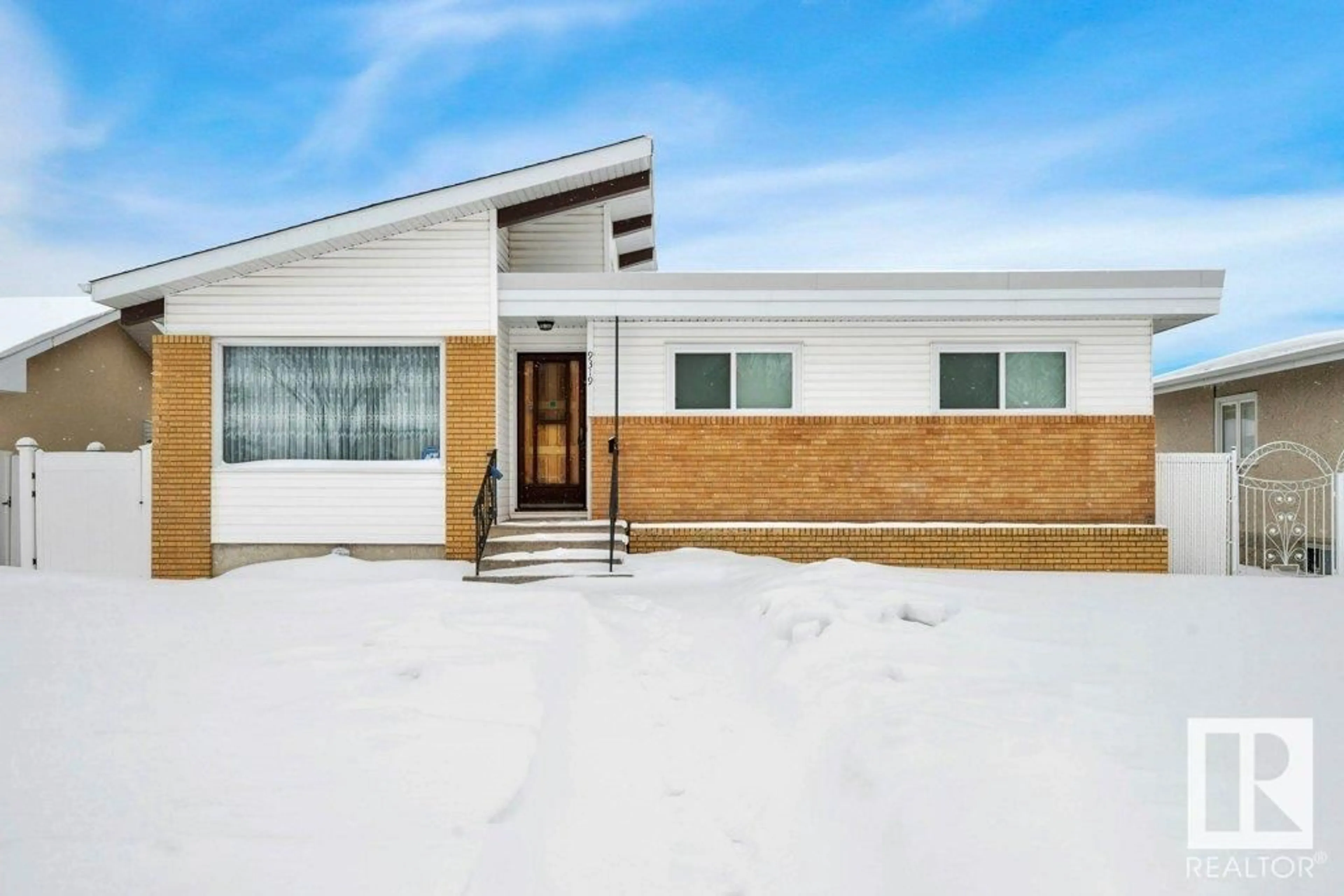 Home with brick exterior material, building for 9319 140 AV NW, Edmonton Alberta T5E2E2