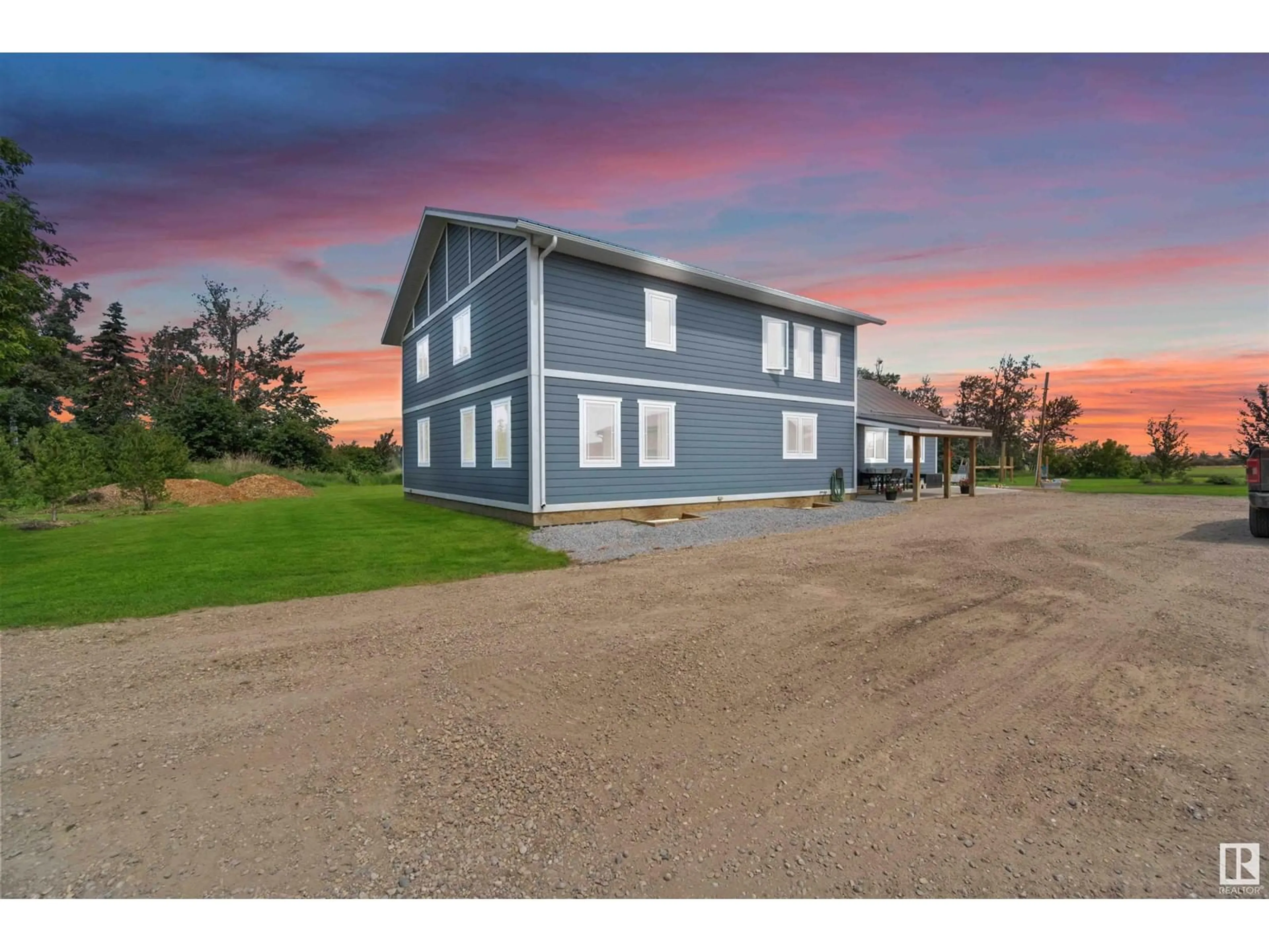 A pic from outside/outdoor area/front of a property/back of a property/a pic from drone, unknown for 1 56221 RGE RD 242, Rural Sturgeon County Alberta T0A0K3