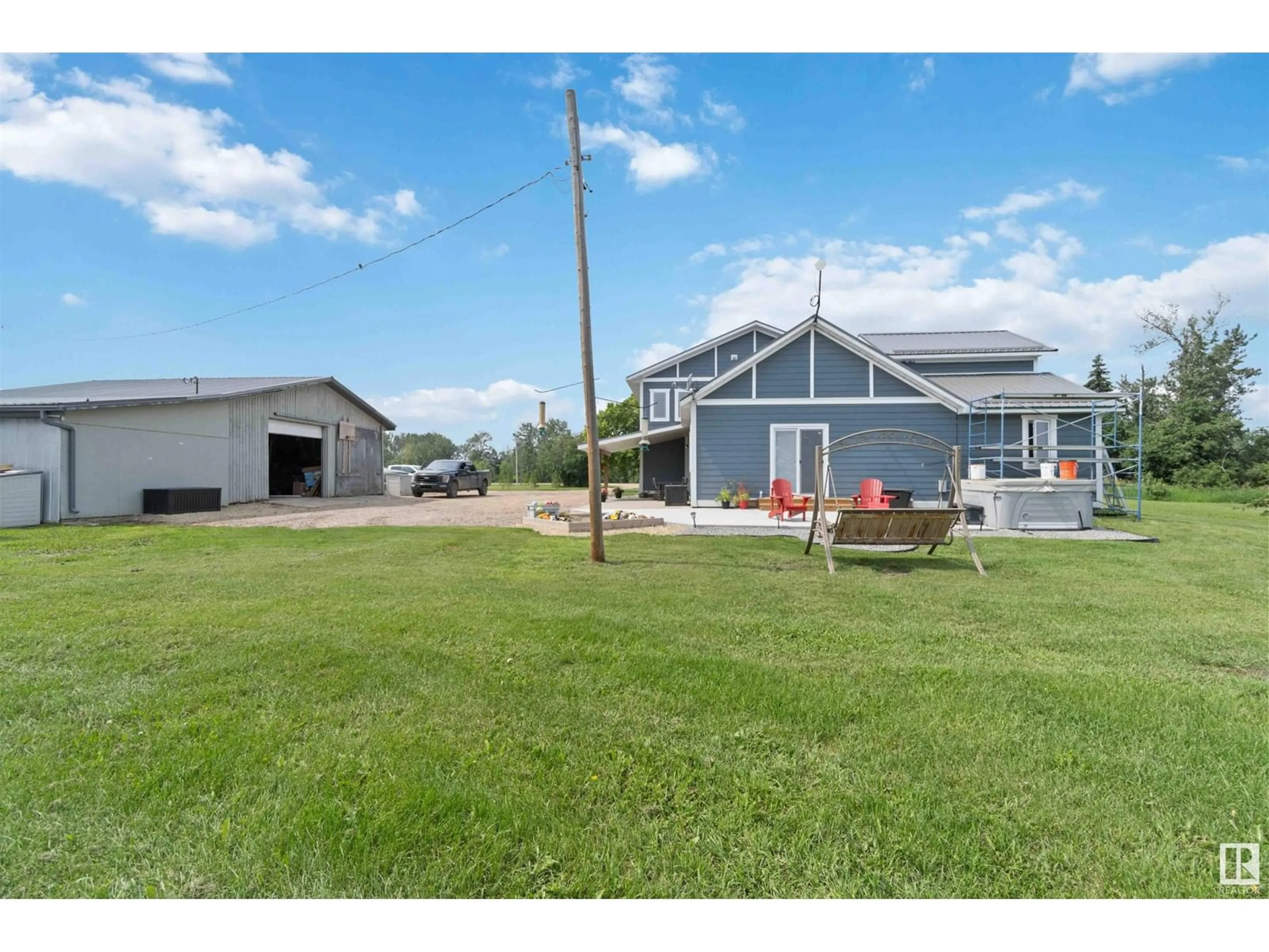 A pic from outside/outdoor area/front of a property/back of a property/a pic from drone, unknown for 1 56221 RGE RD 242, Rural Sturgeon County Alberta T0A0K3