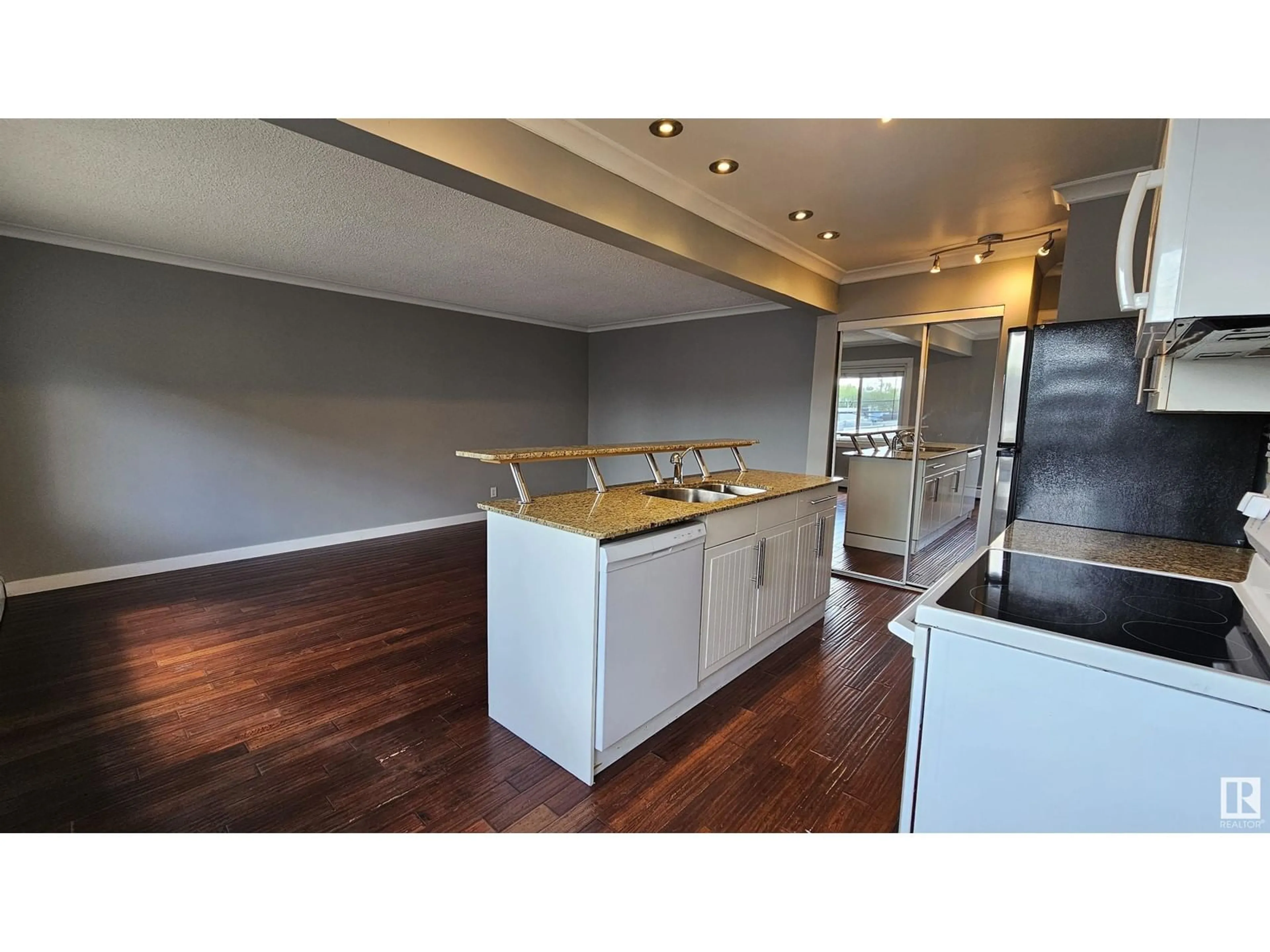 Open concept kitchen, wood/laminate floor for #34 10525 83 AV NW, Edmonton Alberta T6E2E1