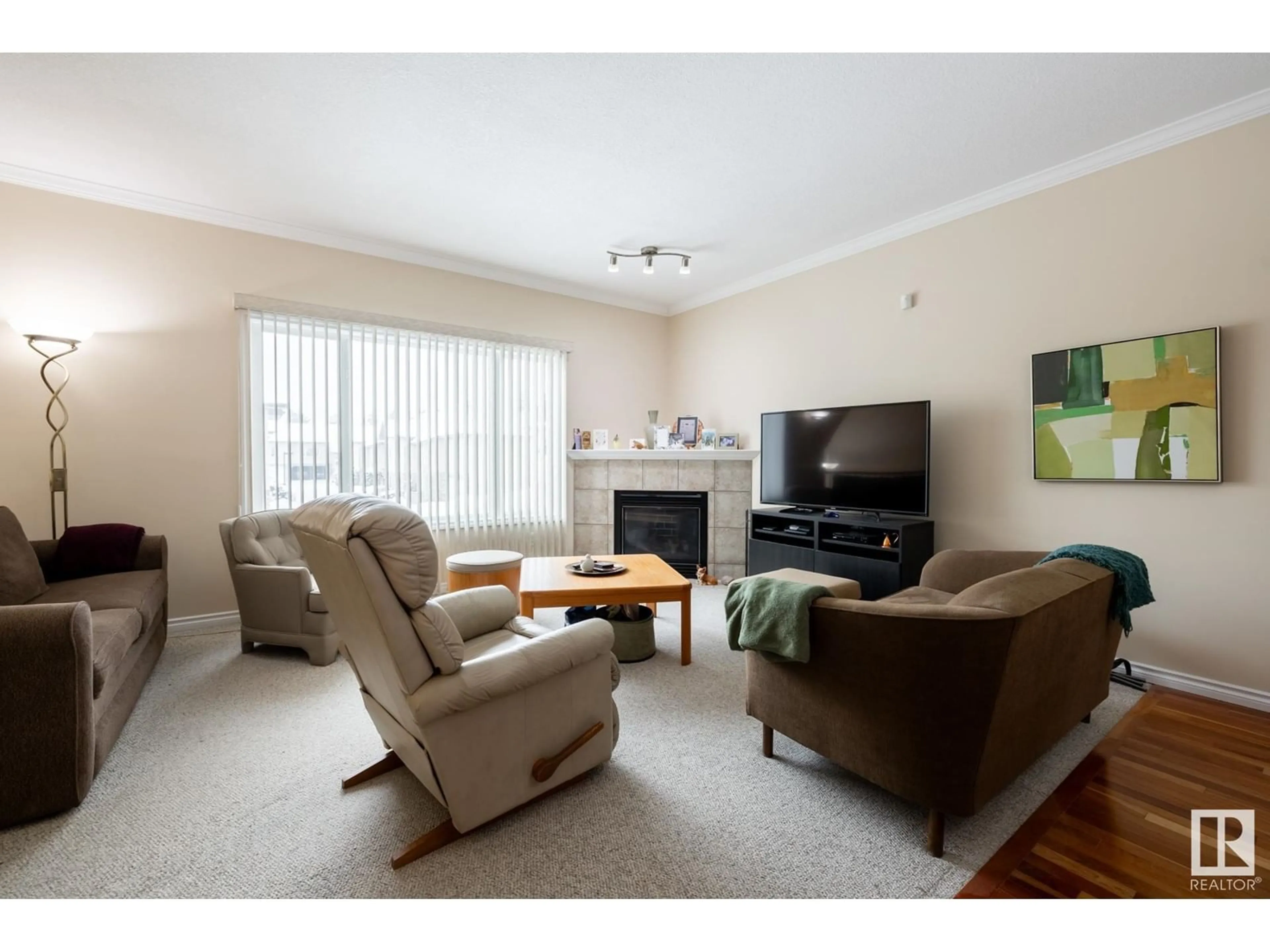 Living room with furniture, wood/laminate floor for #4 17715 96 AV NW, Edmonton Alberta T5T6W9