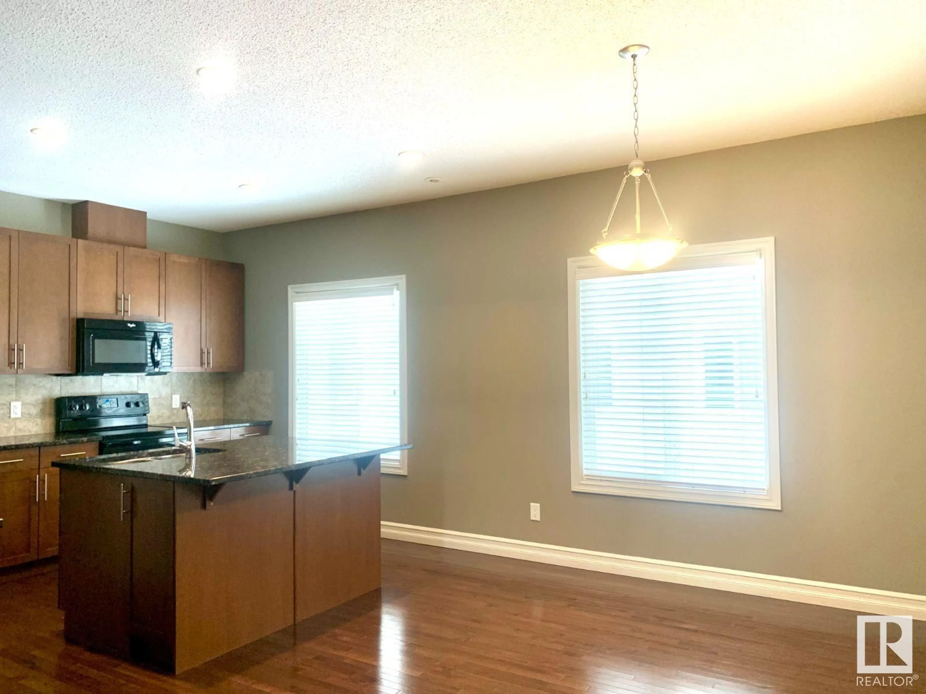 Open concept kitchen, wood/laminate floor for #76 2003 RABBIT HILL RD NW, Edmonton Alberta T6R0R7