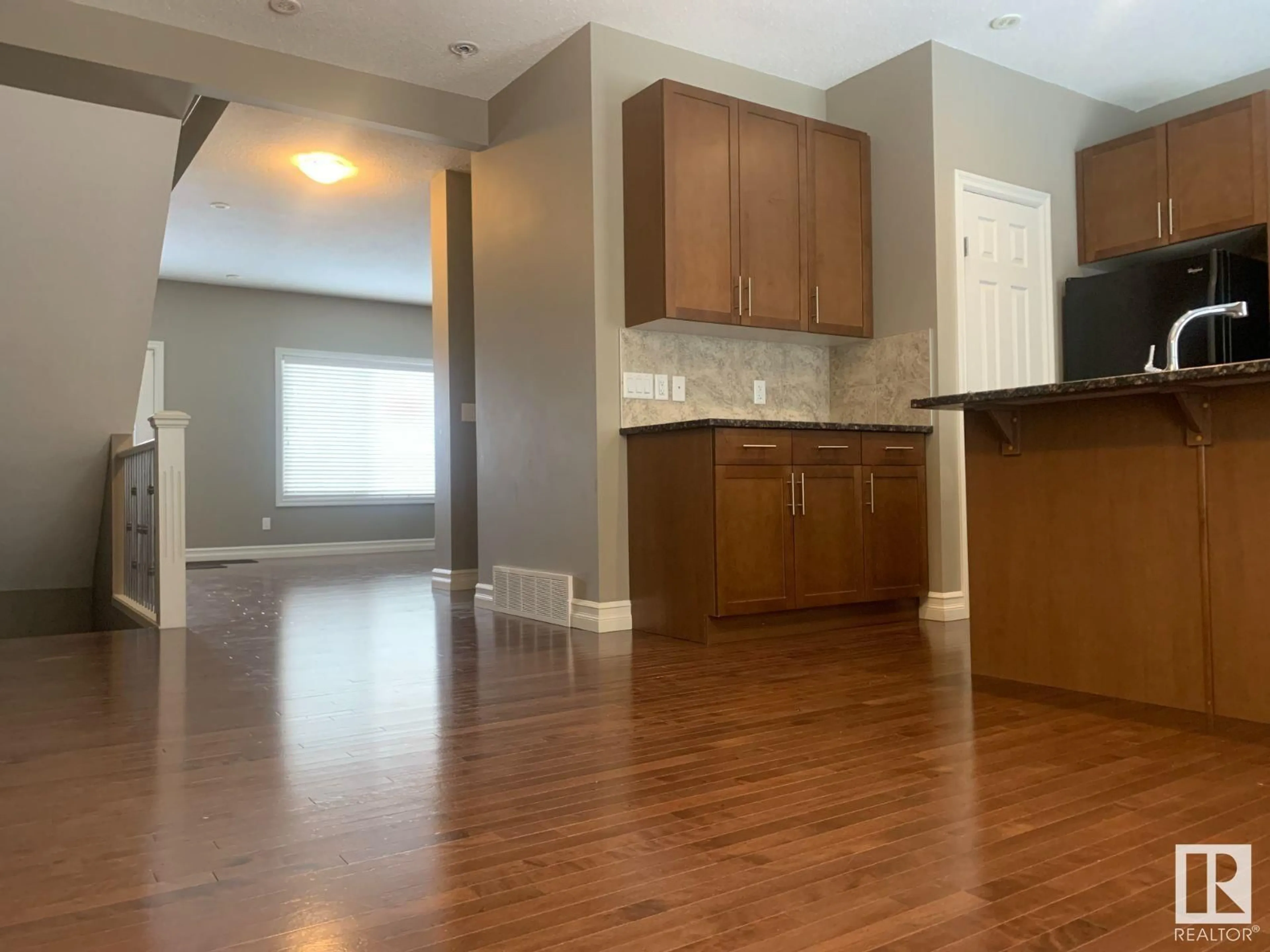 Open concept kitchen, wood/laminate floor for #76 2003 RABBIT HILL RD NW, Edmonton Alberta T6R0R7