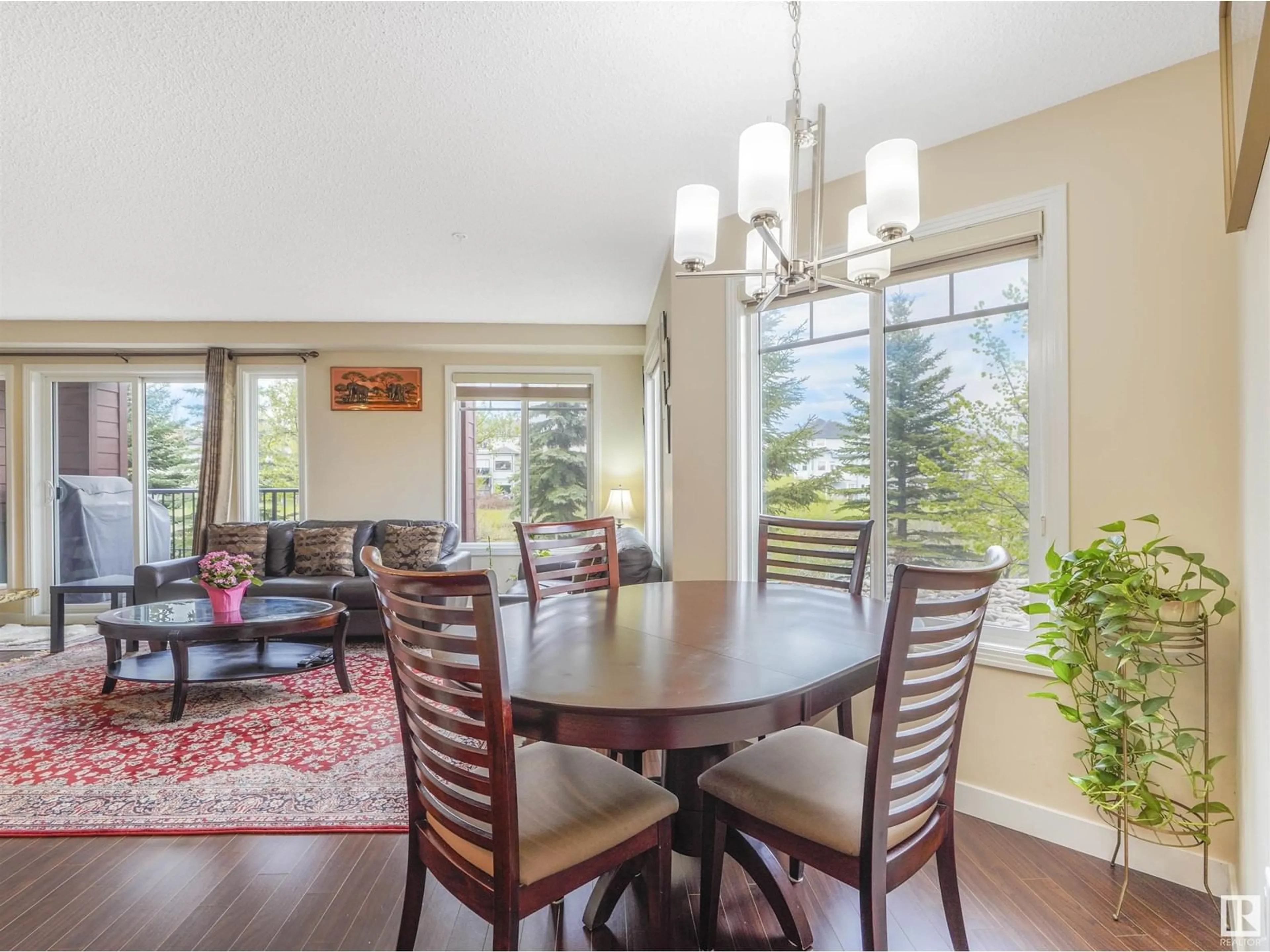 Dining room, wood/laminate floor for #110 7021 TERWILLIGAR ST NW NW, Edmonton Alberta T6R0W5