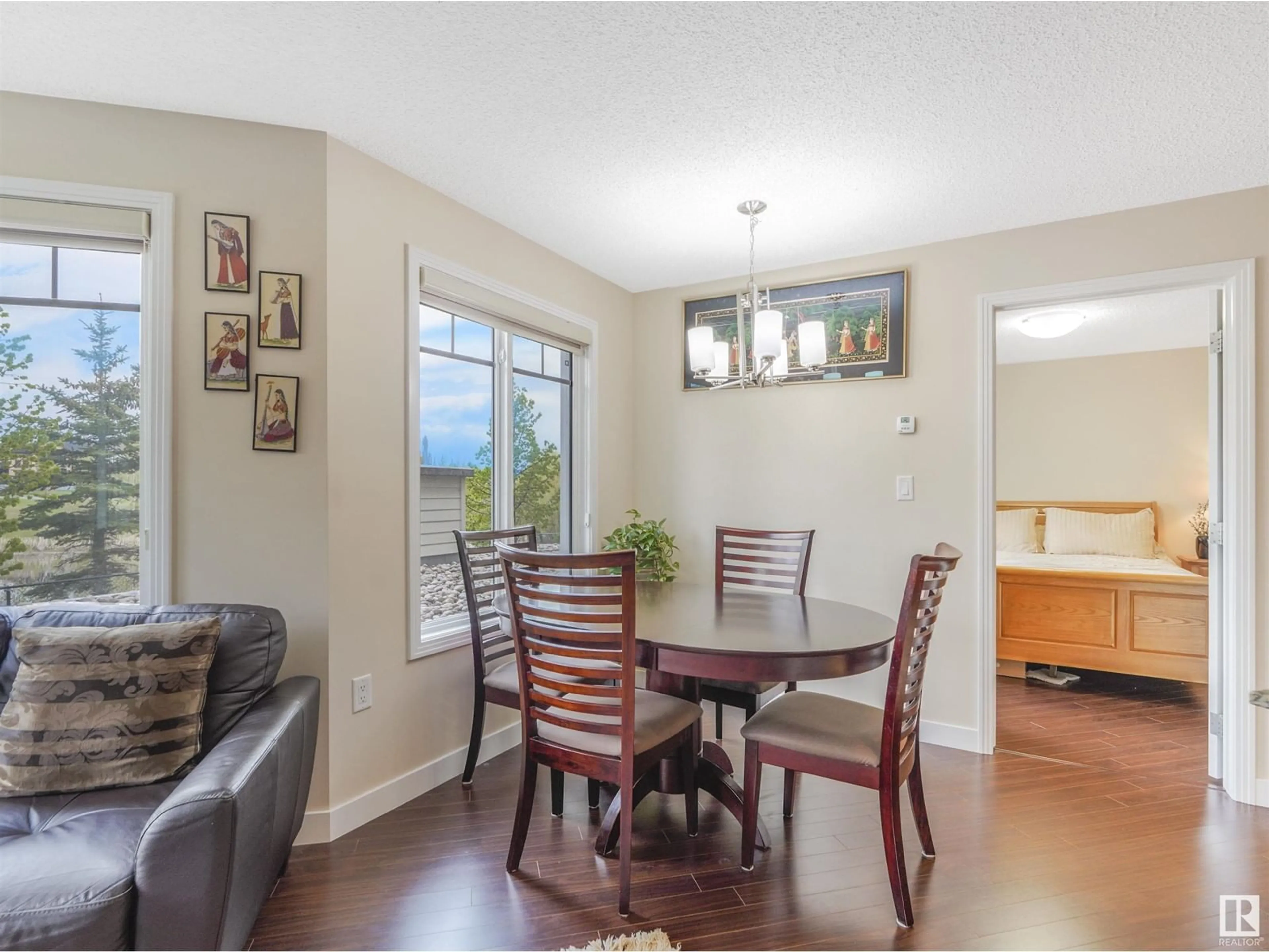 Dining room, wood/laminate floor for #110 7021 TERWILLIGAR ST NW NW, Edmonton Alberta T6R0W5