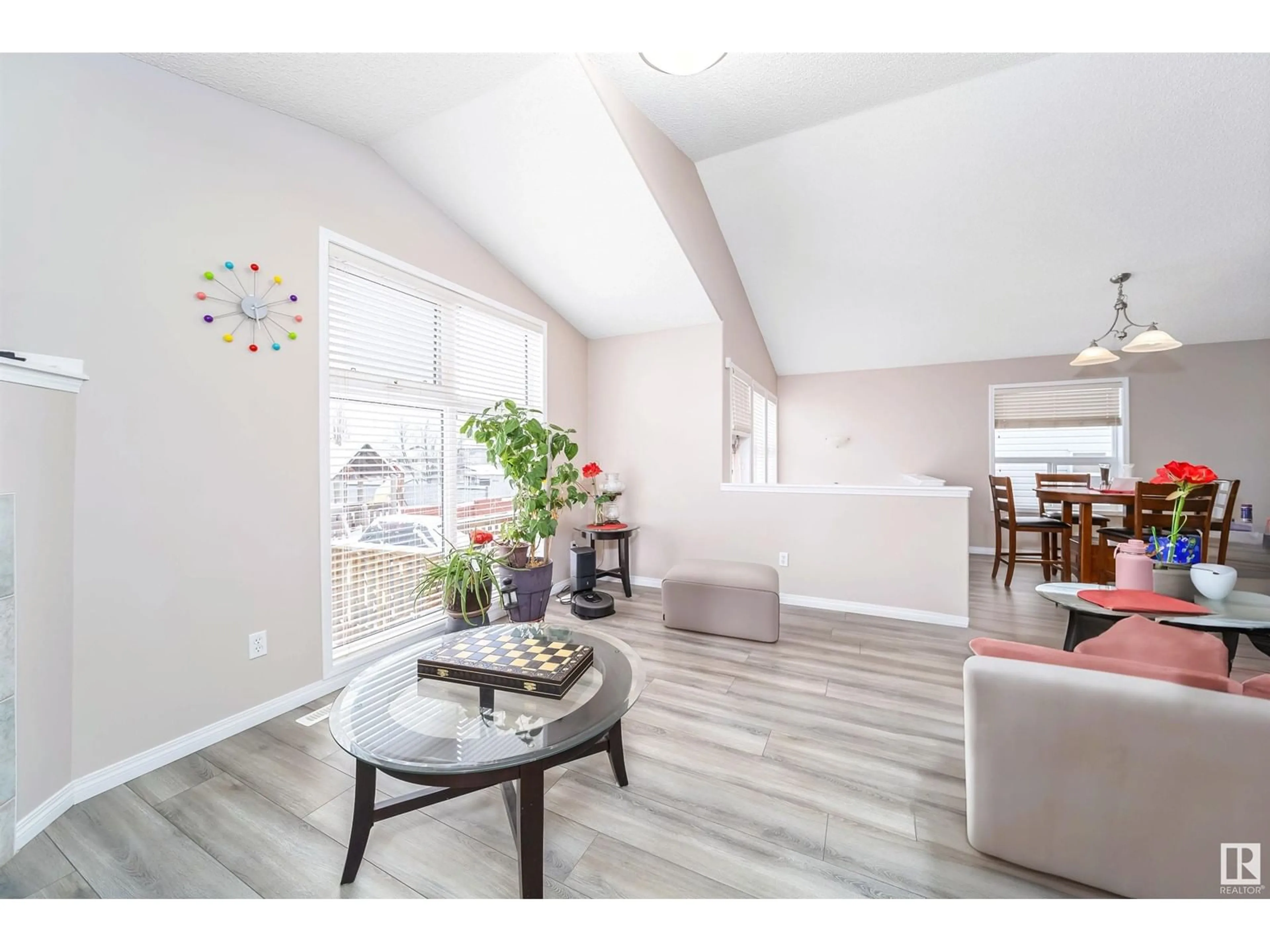 Living room with furniture, wood/laminate floor for 3709 22A ST NW, Edmonton Alberta T6T1V7