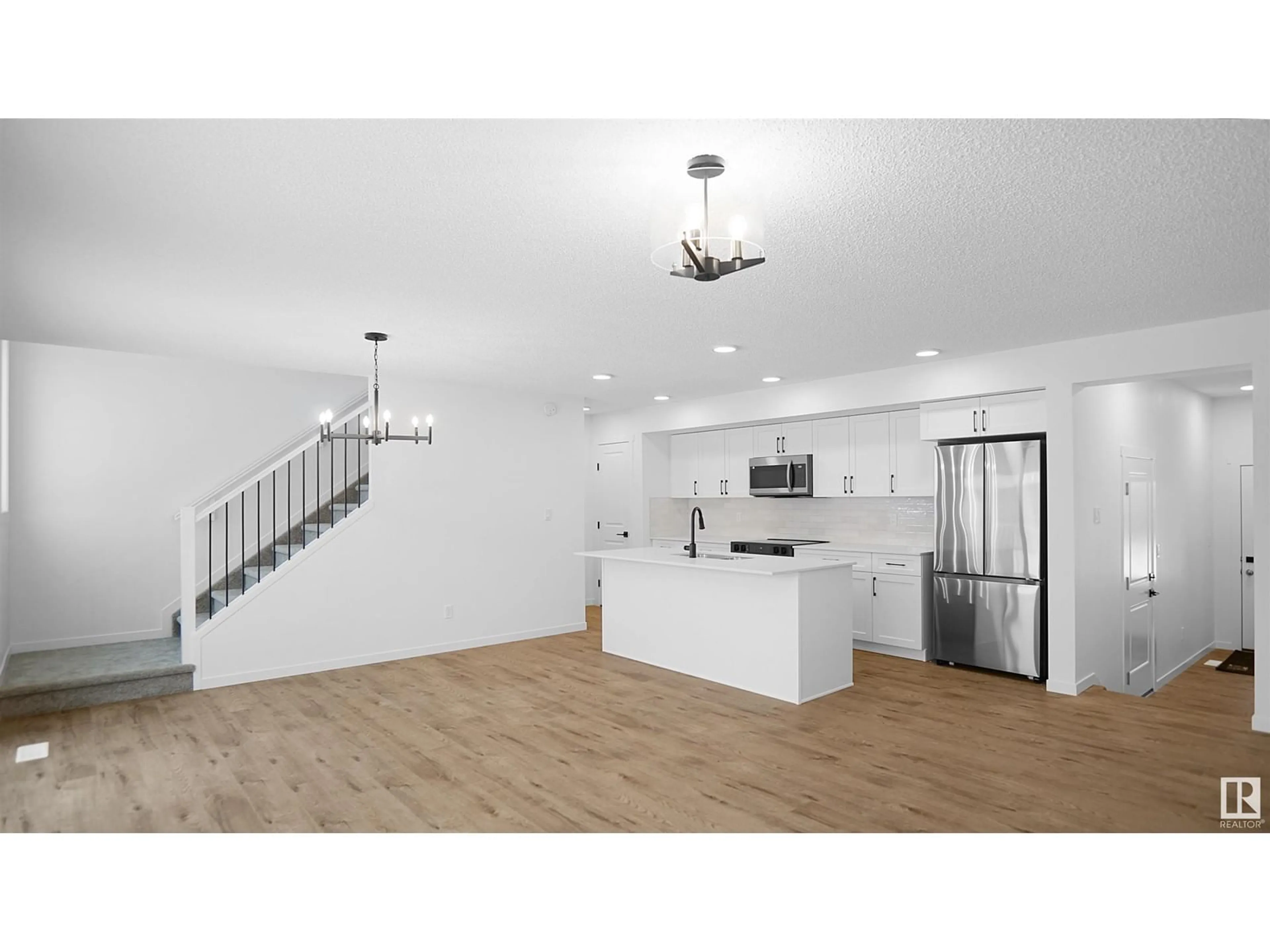 Open concept kitchen, wood/laminate floor for #24 905 172 ST SW, Edmonton Alberta T6W3V5