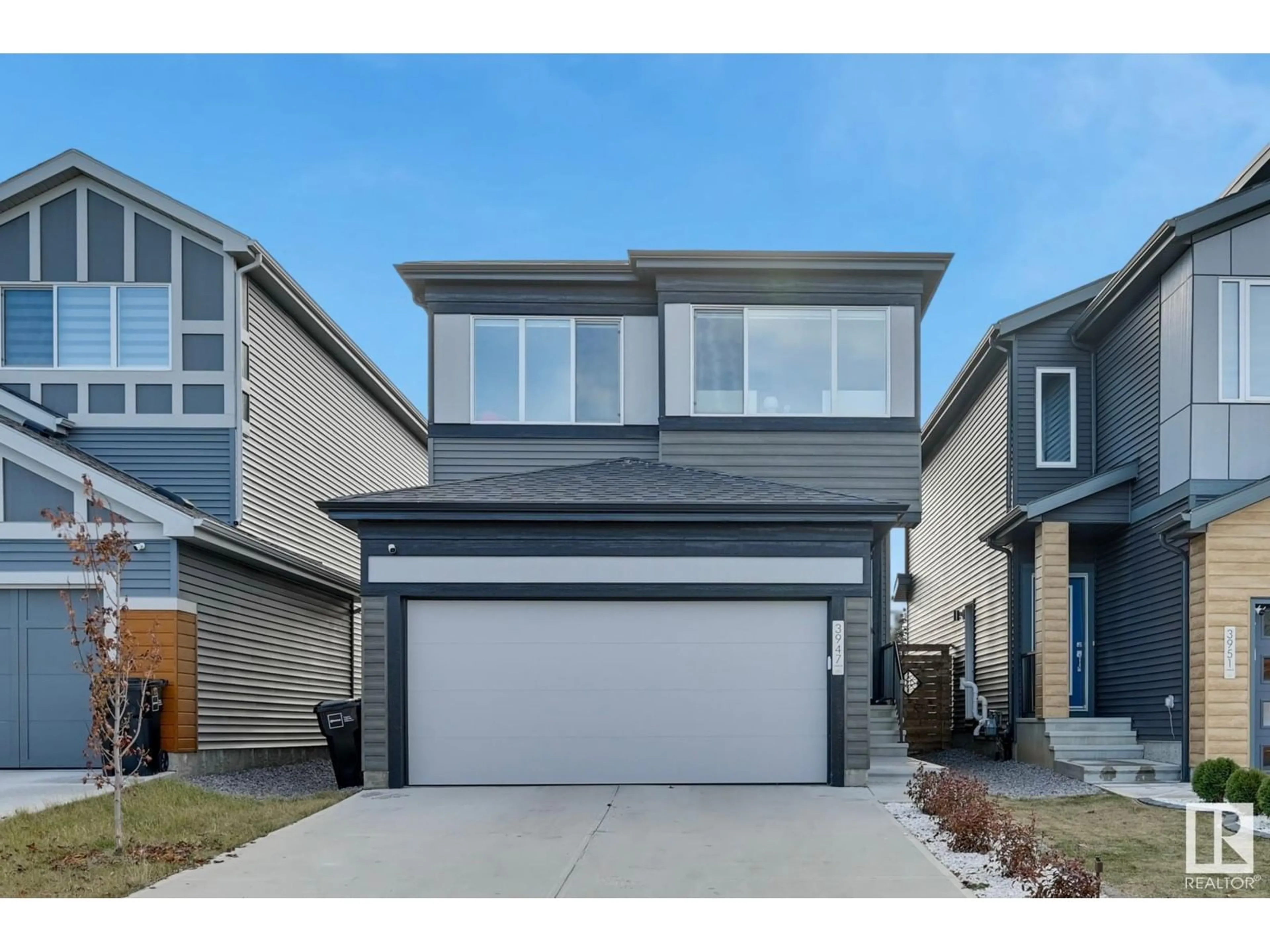 Home with vinyl exterior material, street for 3947 5 AV SW, Edmonton Alberta T6X2X8