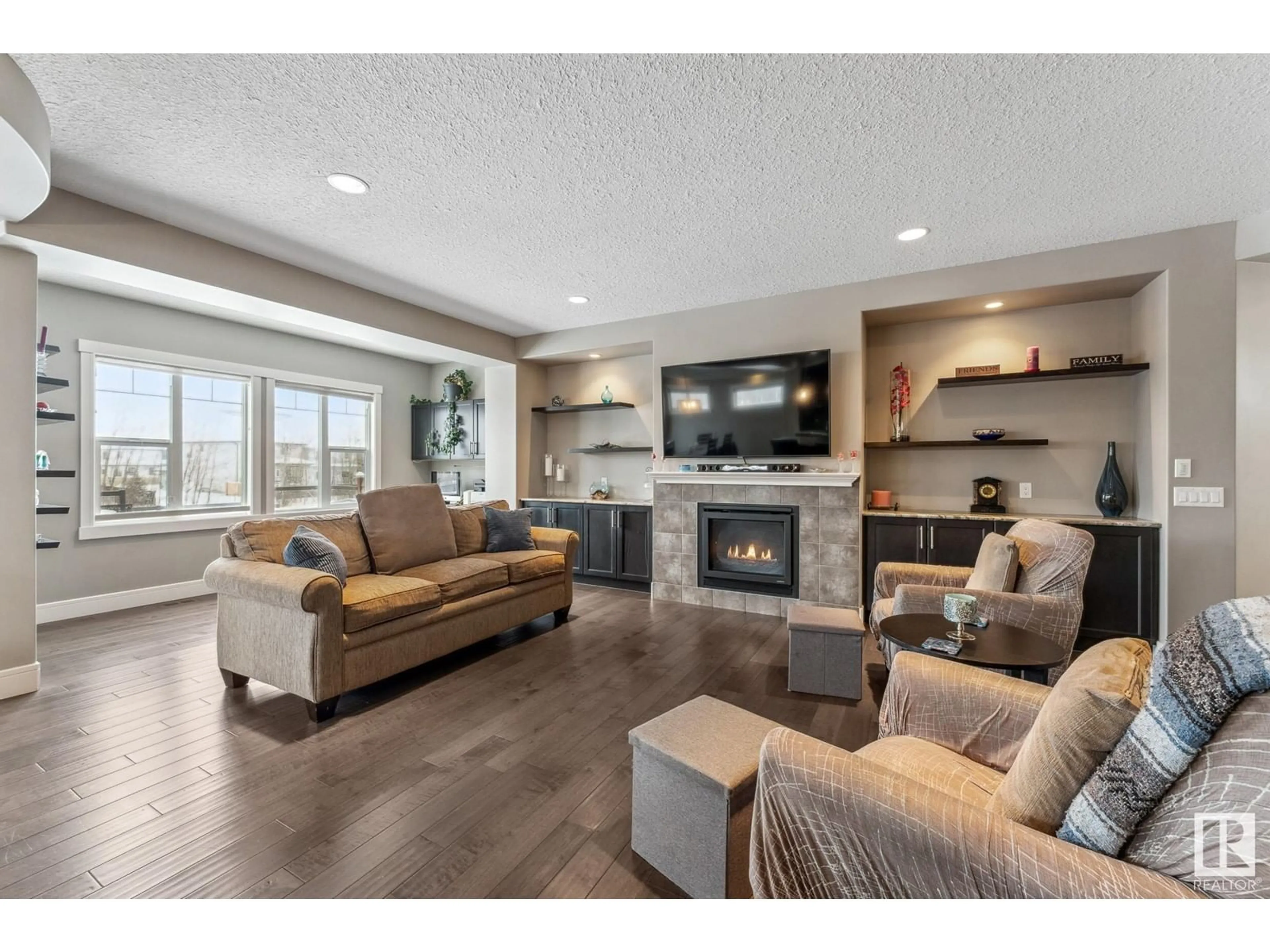 Living room with furniture, wood/laminate floor for 3651 8 ST NW, Edmonton Alberta T6T0S4