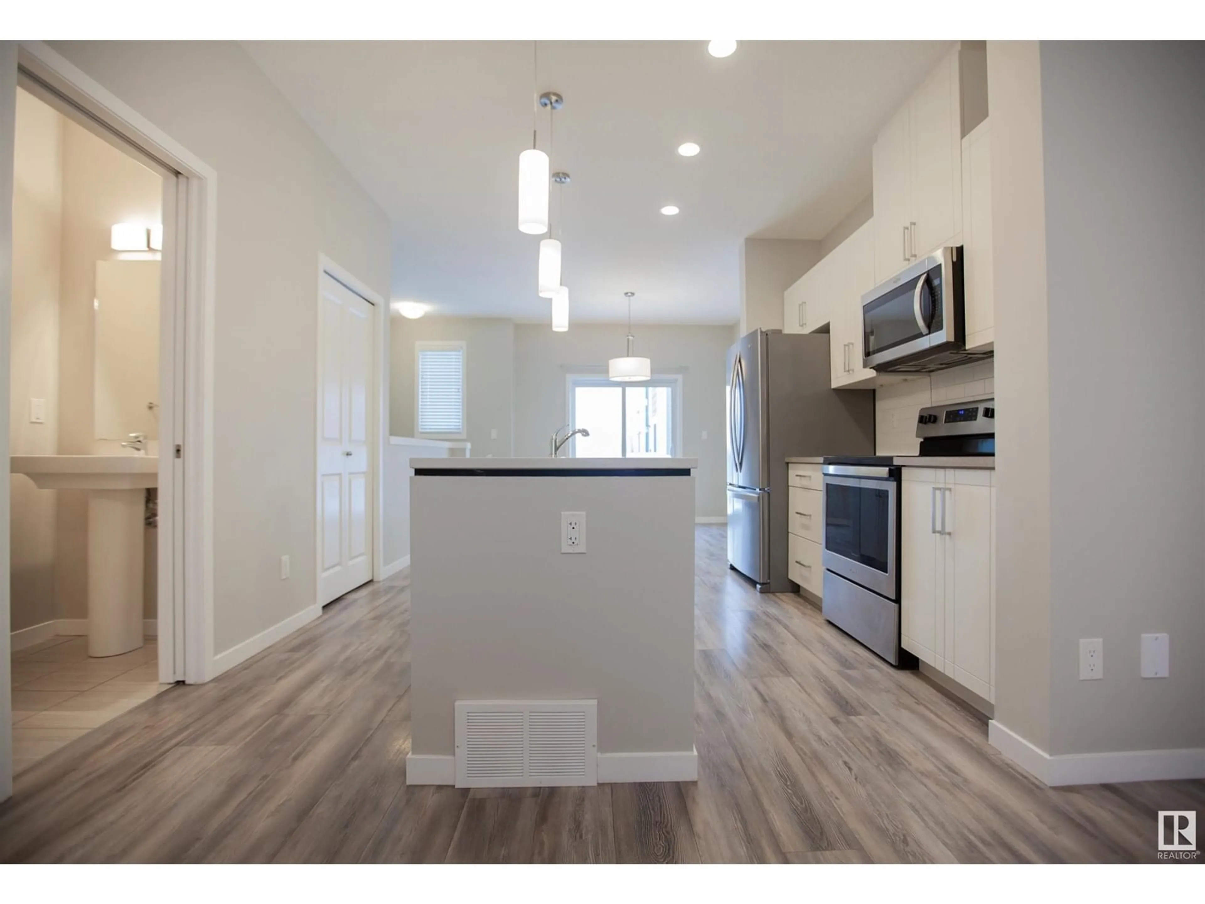 Open concept kitchen, wood/laminate floor for #95 320 SECORD BV NW, Edmonton Alberta T5T7E8