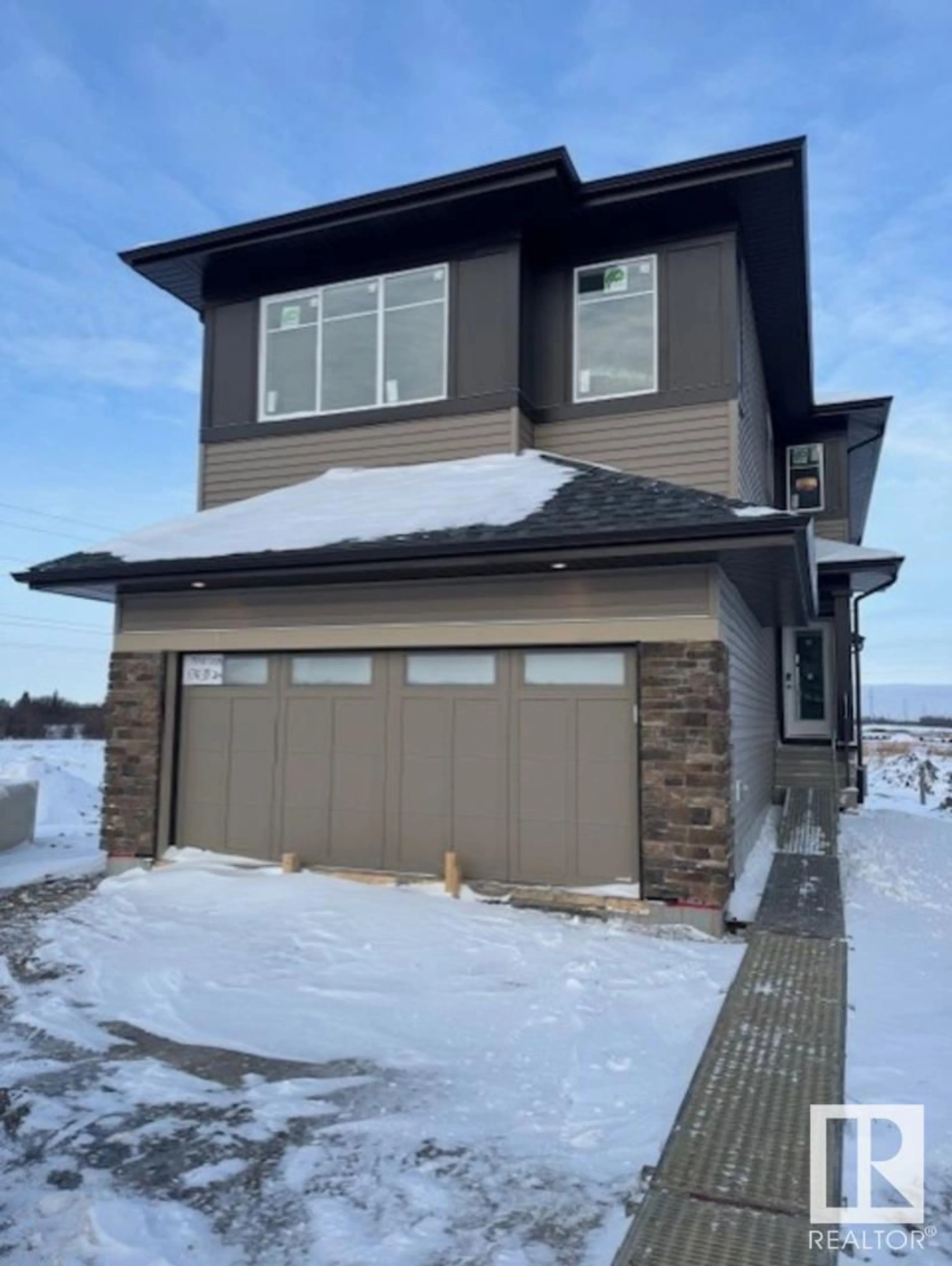 Home with vinyl exterior material, street for 17439 2 ST NW, Edmonton Alberta T5Y4G6