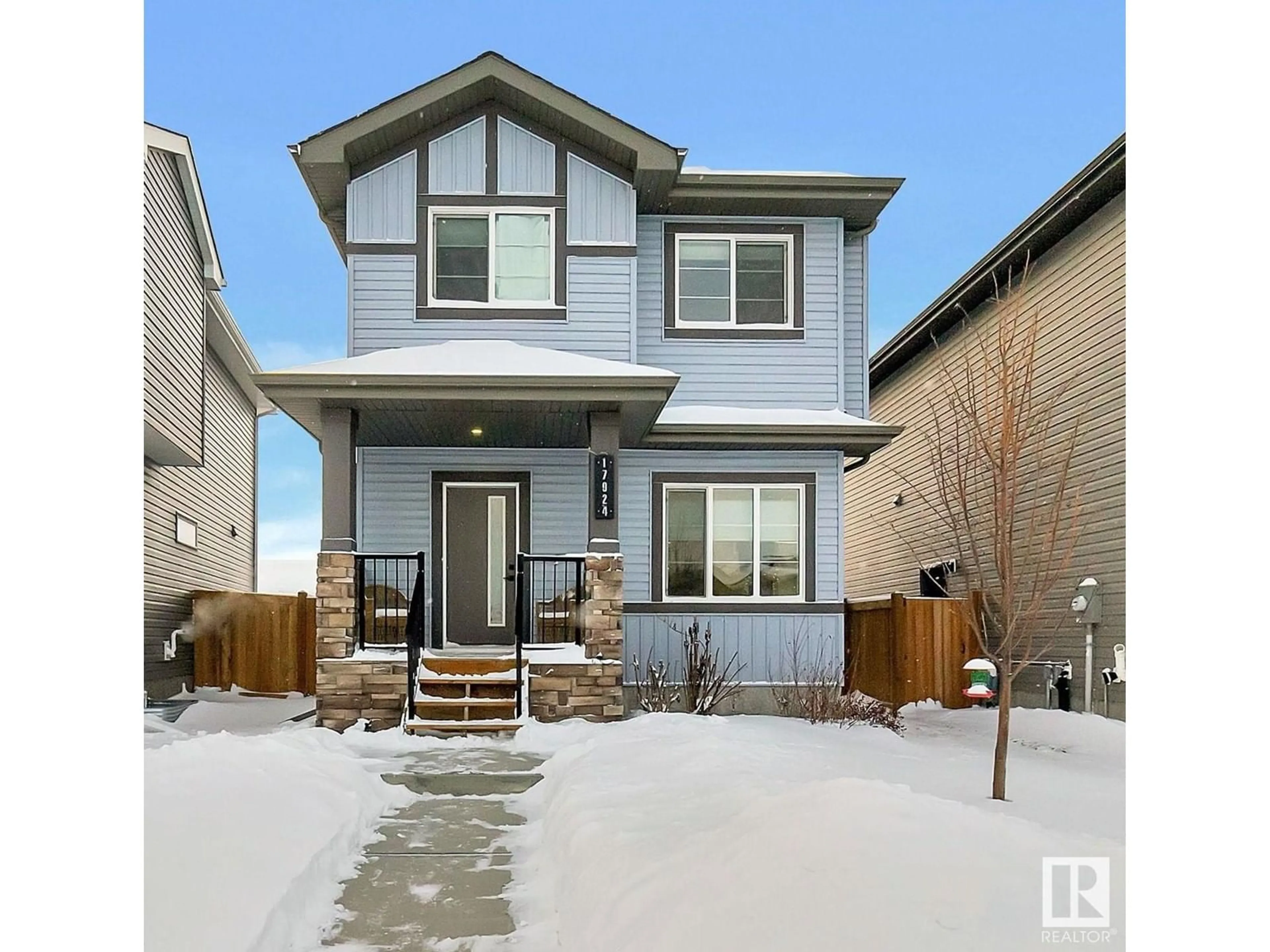 Home with vinyl exterior material, street for 17924 61 ST NW NW, Edmonton Alberta T5Y3X1