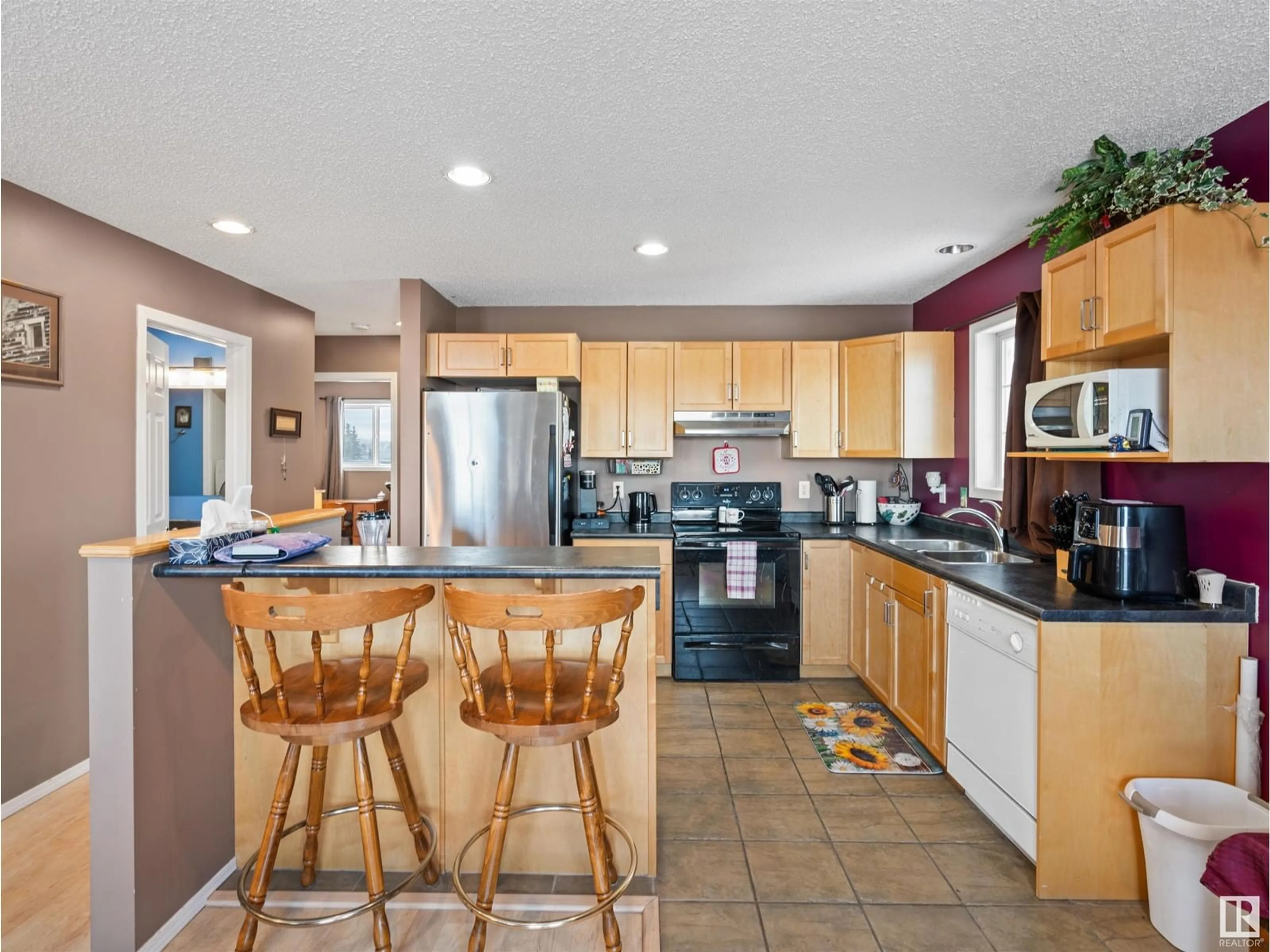 Open concept kitchen, ceramic/tile floor for #8 4917 51 AV, Cold Lake Alberta T9M2B8