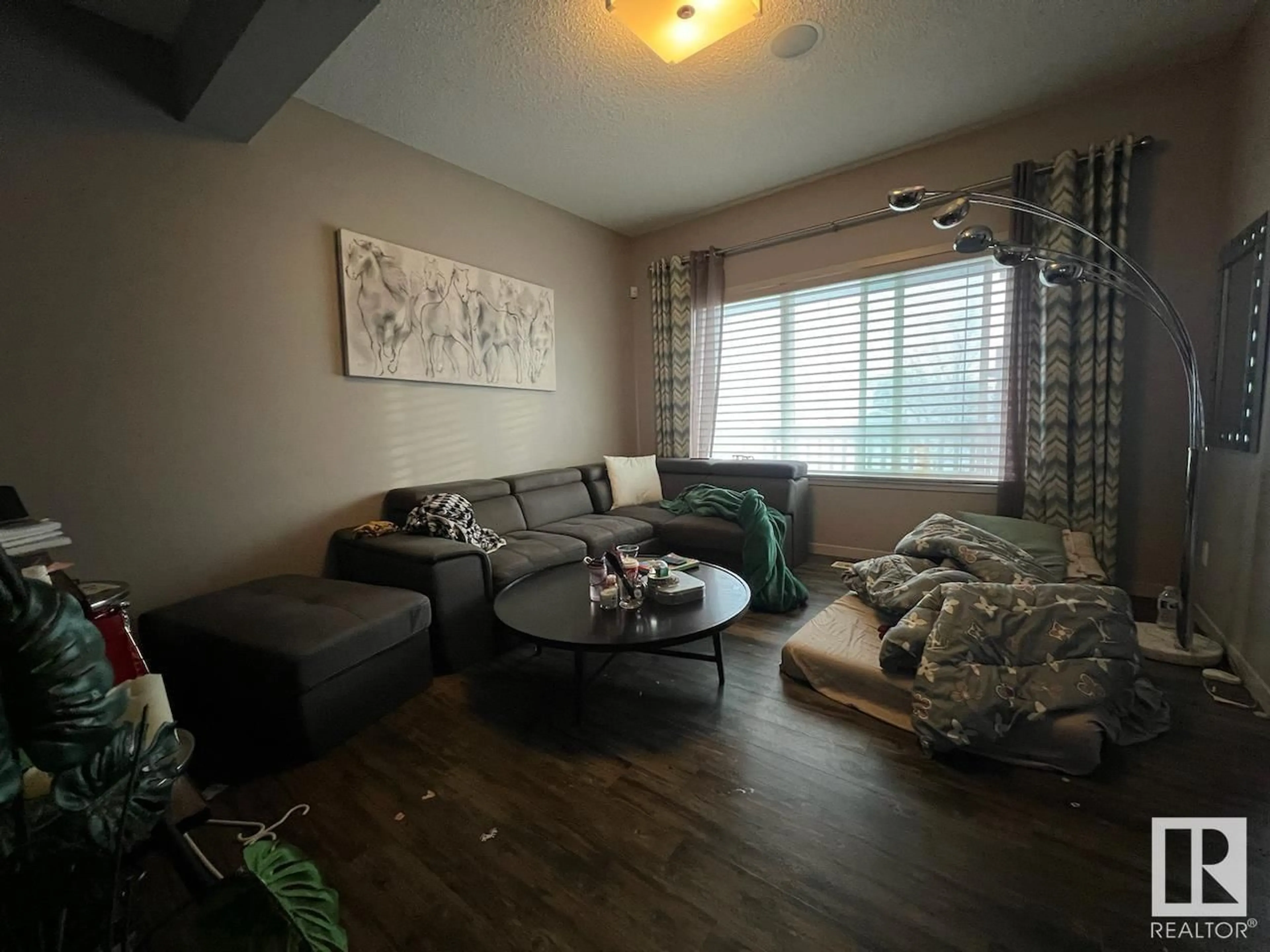 Living room with furniture, wood/laminate floor for 2344 GLENRIDDING BV SW, Edmonton Alberta T6W3K6