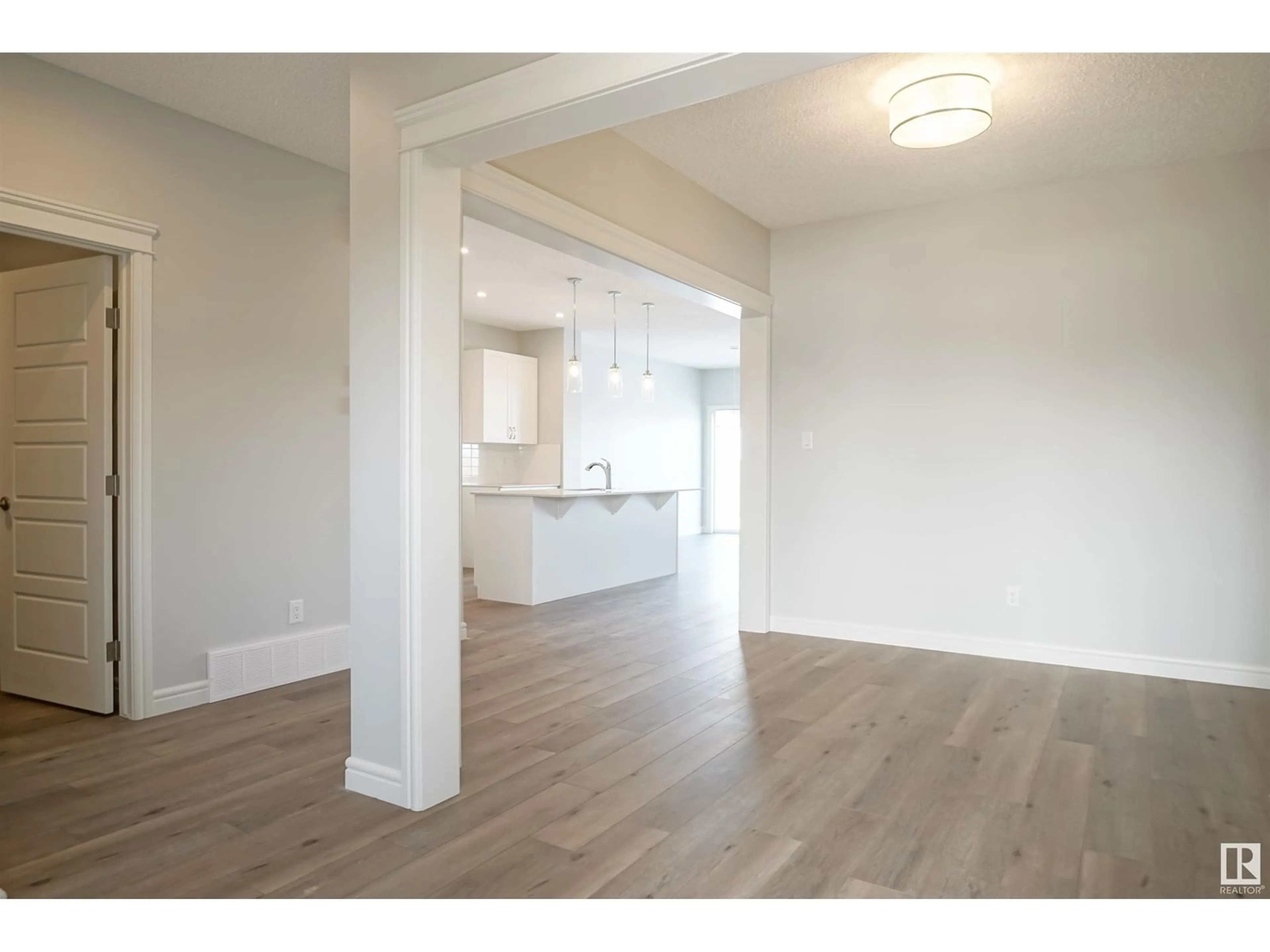 Open concept kitchen, wood/laminate floor for 16531 3 ST NE, Edmonton Alberta T5Y4E9