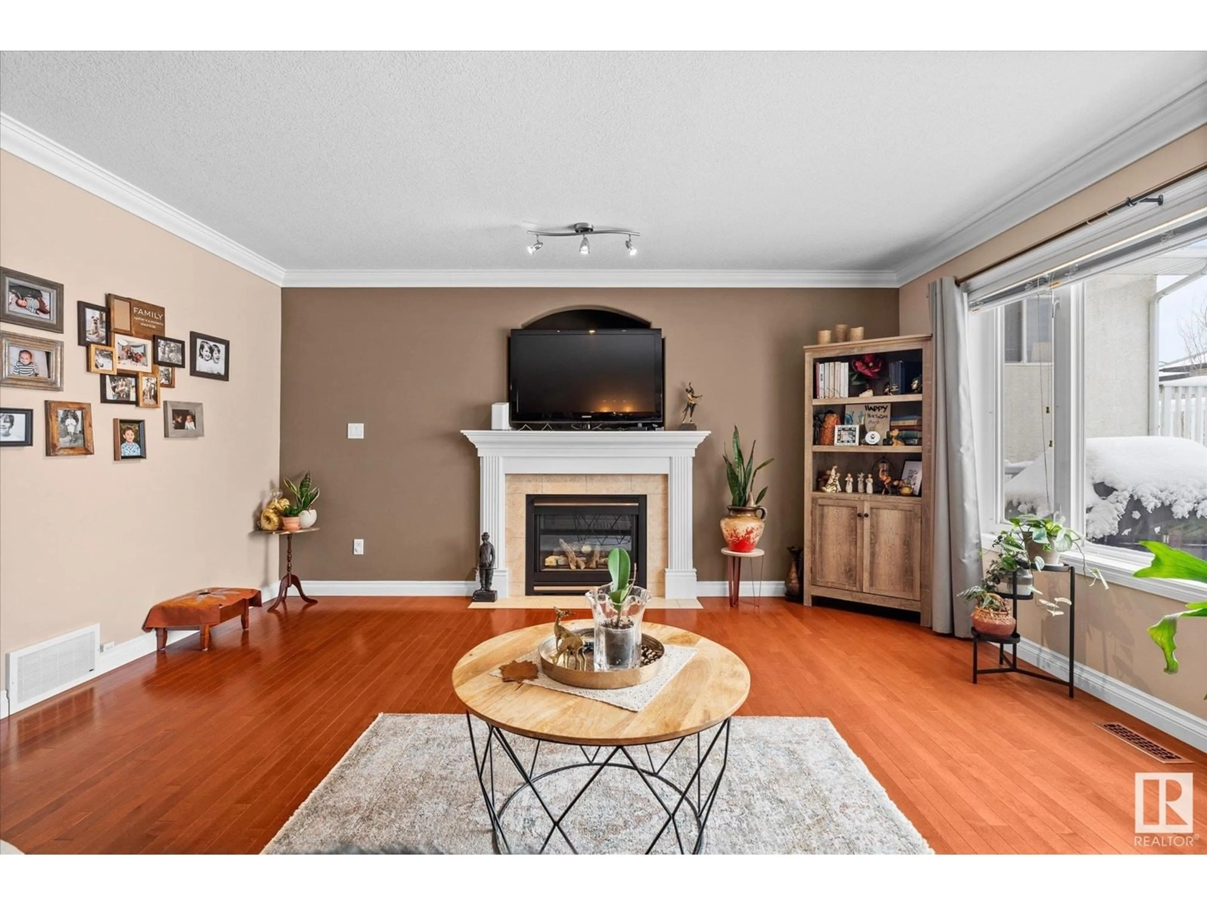 Living room with furniture, wood/laminate floor for 16420 61 ST NW, Edmonton Alberta T5Y0A7