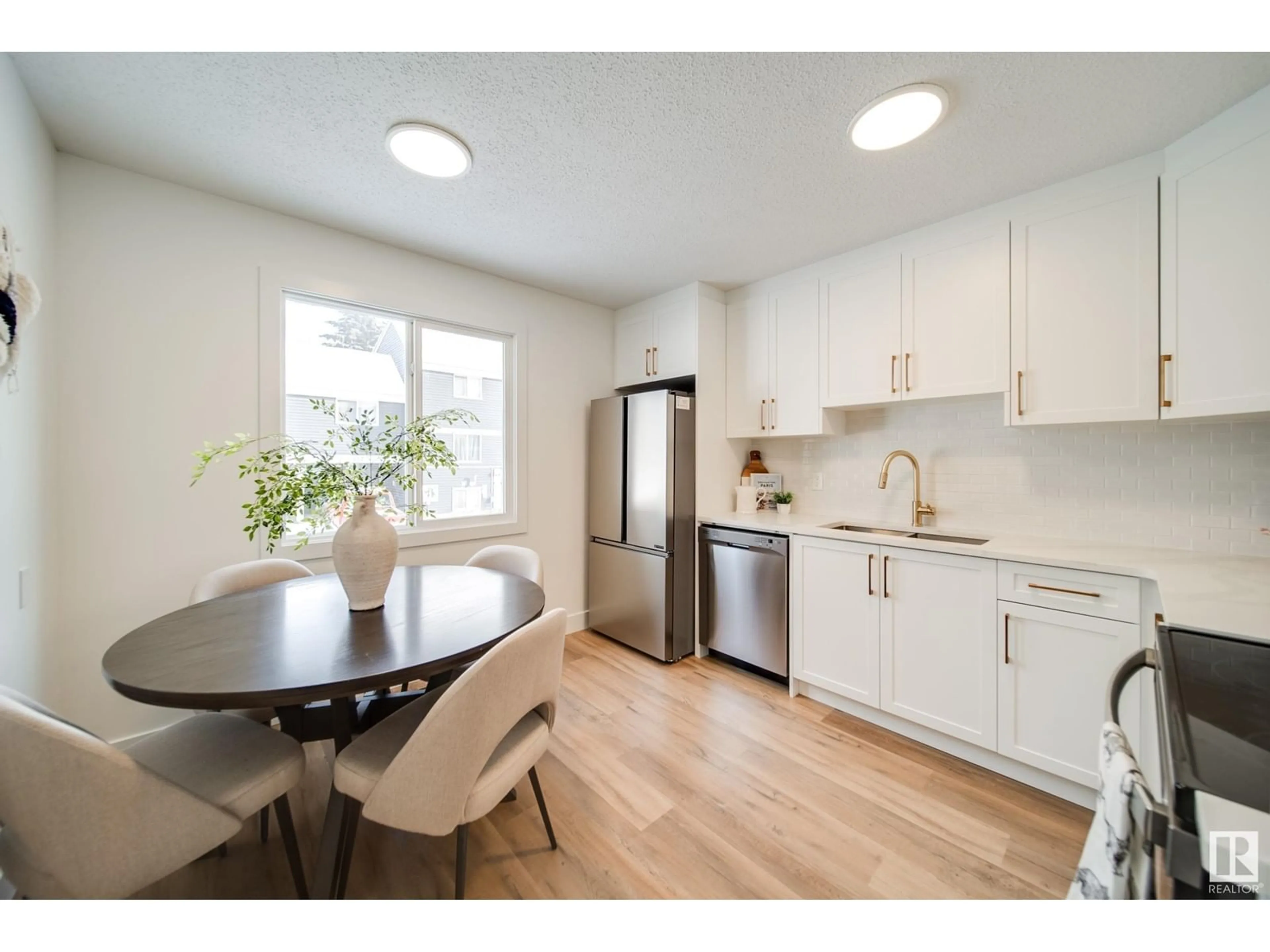 Open concept kitchen, wood/laminate floor for 306 MORIN MAZE MZ NW, Edmonton Alberta T6K1V1