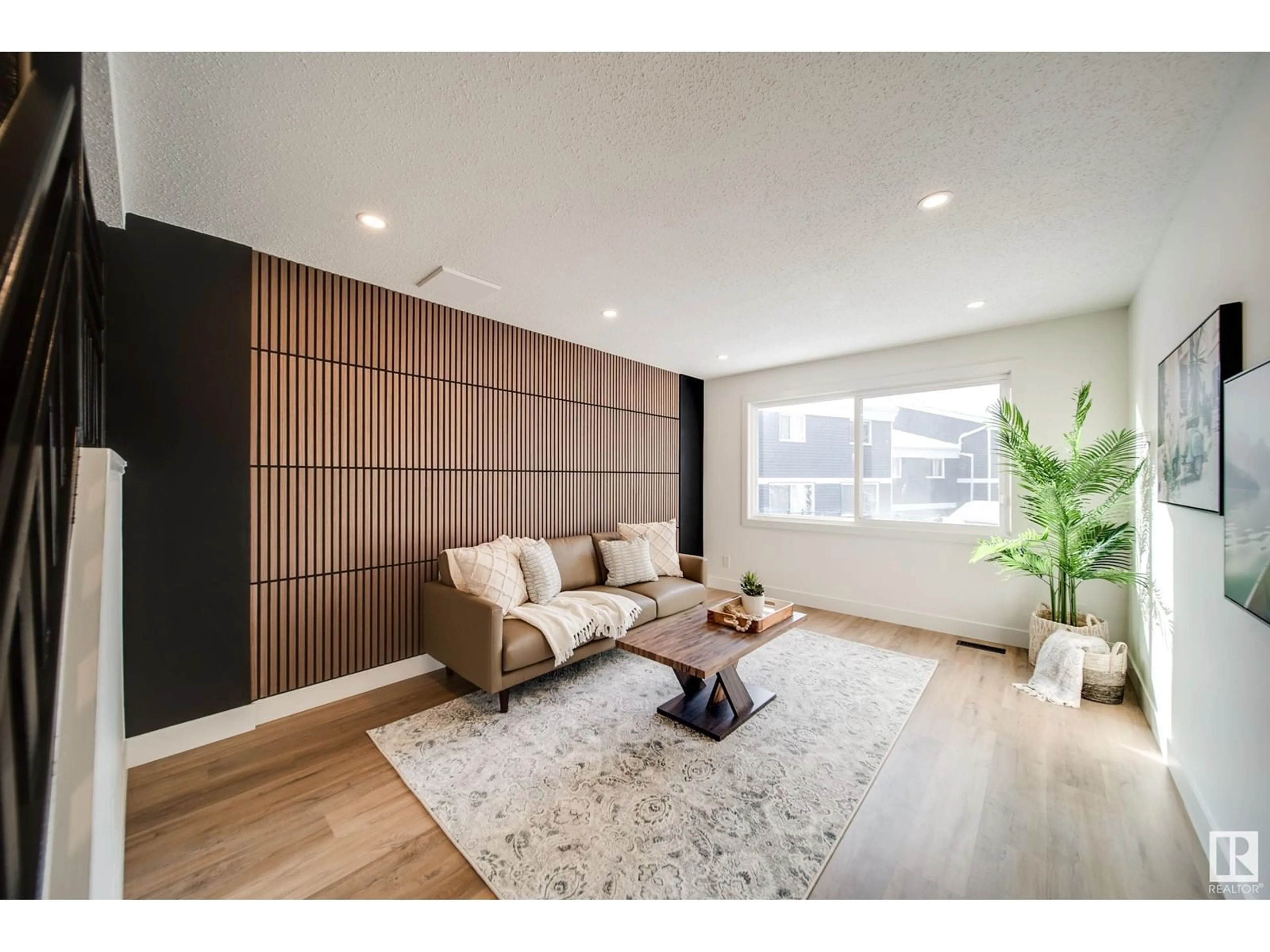 Living room with furniture, wood/laminate floor for 306 MORIN MAZE MZ NW, Edmonton Alberta T6K1V1