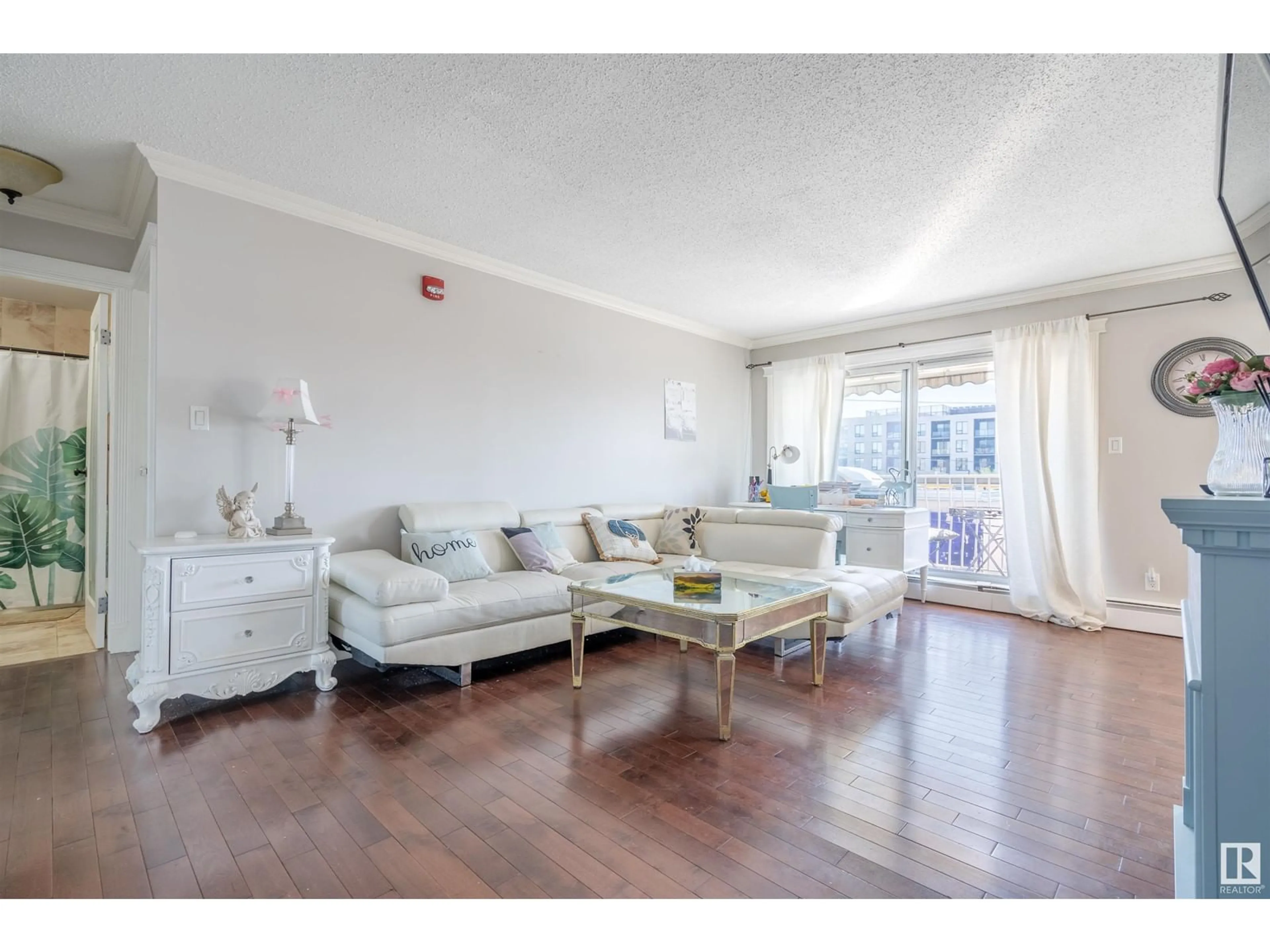 Living room with furniture, wood/laminate floor for #404 10625 83 AV NW, Edmonton Alberta T6E2E3