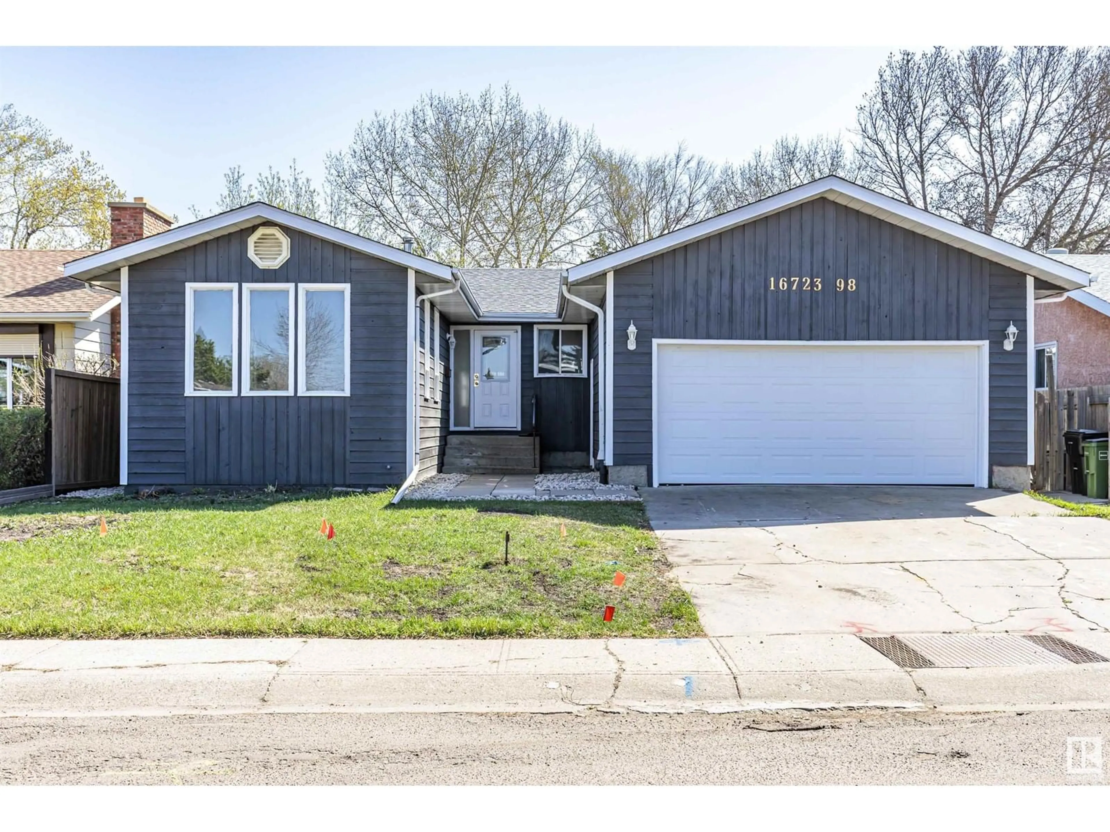 Home with vinyl exterior material, street for 16723 98 ST NW, Edmonton Alberta T5X2S8