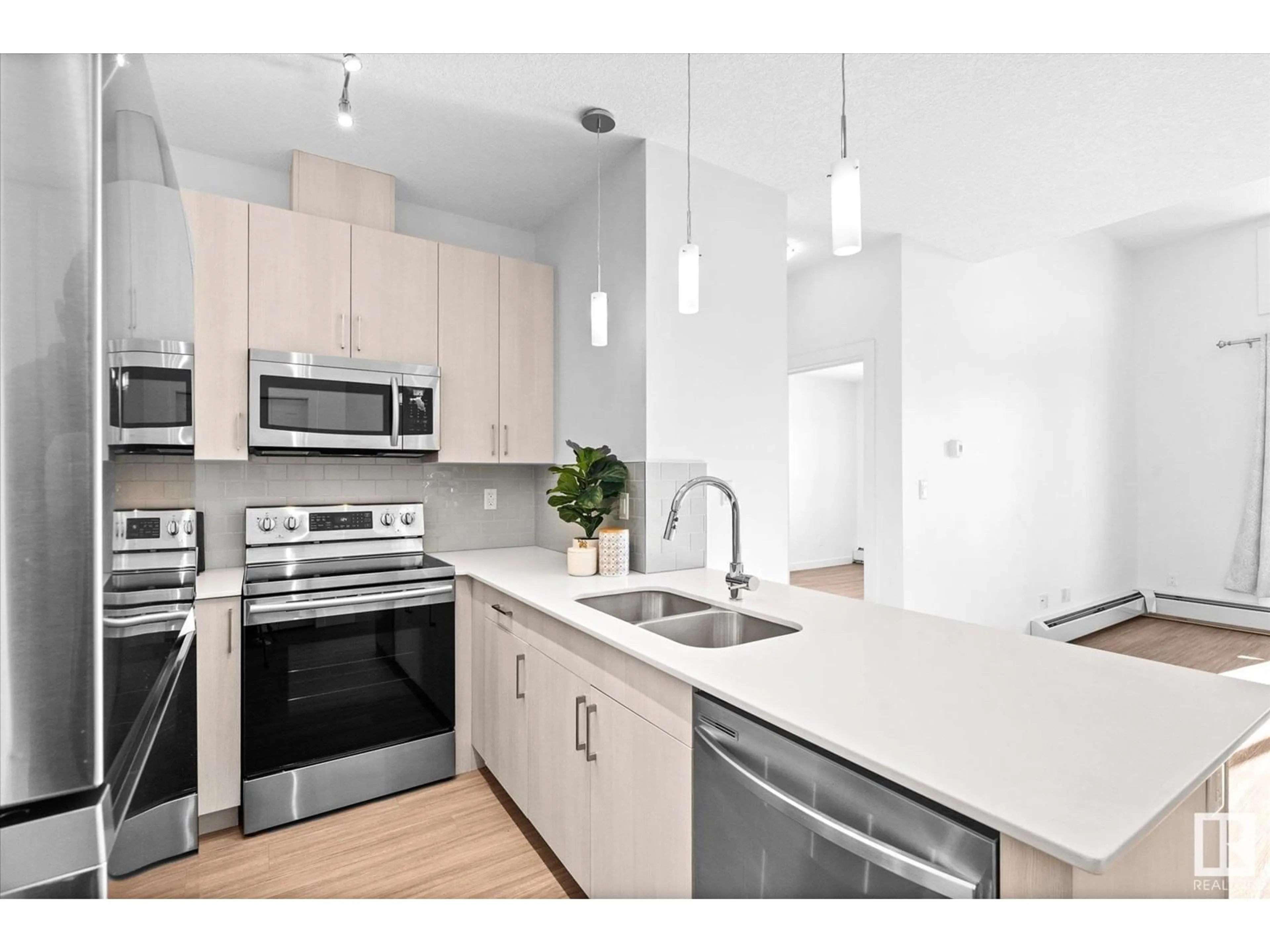 Open concept kitchen, ceramic/tile floor for #404 17 COLUMBIA AV W, Devon Alberta T9G1K1