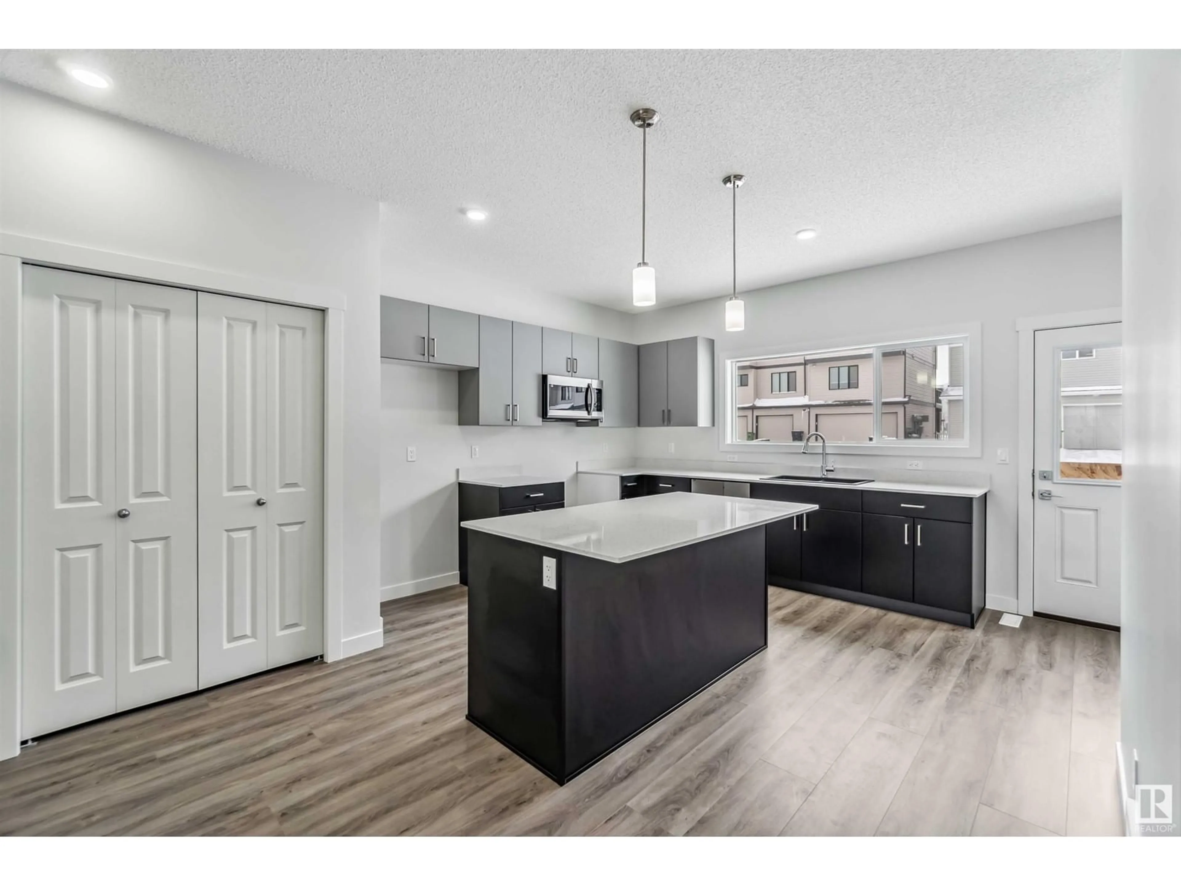 Open concept kitchen, unknown for 1635 16 AV NW, Edmonton Alberta T6T2S1