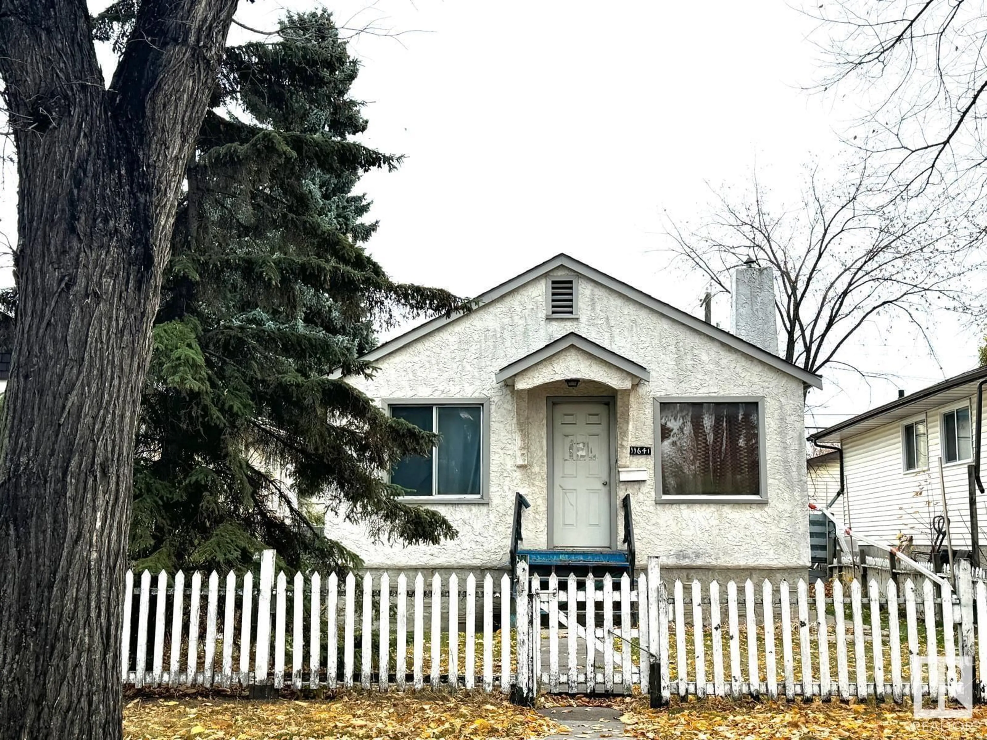 Home with vinyl exterior material, street for 11641 95A ST NW, Edmonton Alberta T5G1P7