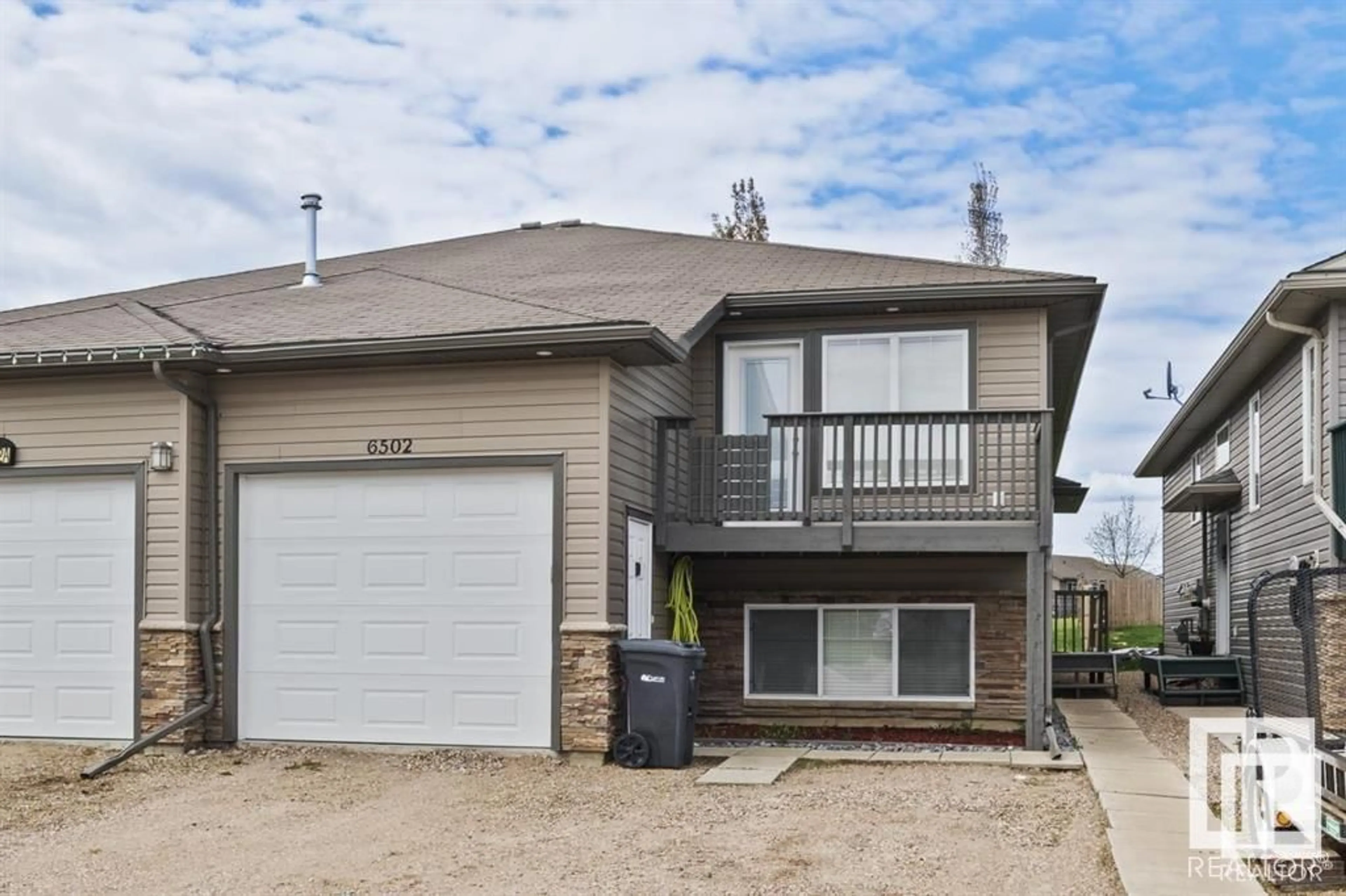 Home with vinyl exterior material, street for 6502B 47 ST, Cold Lake Alberta T9M0B1