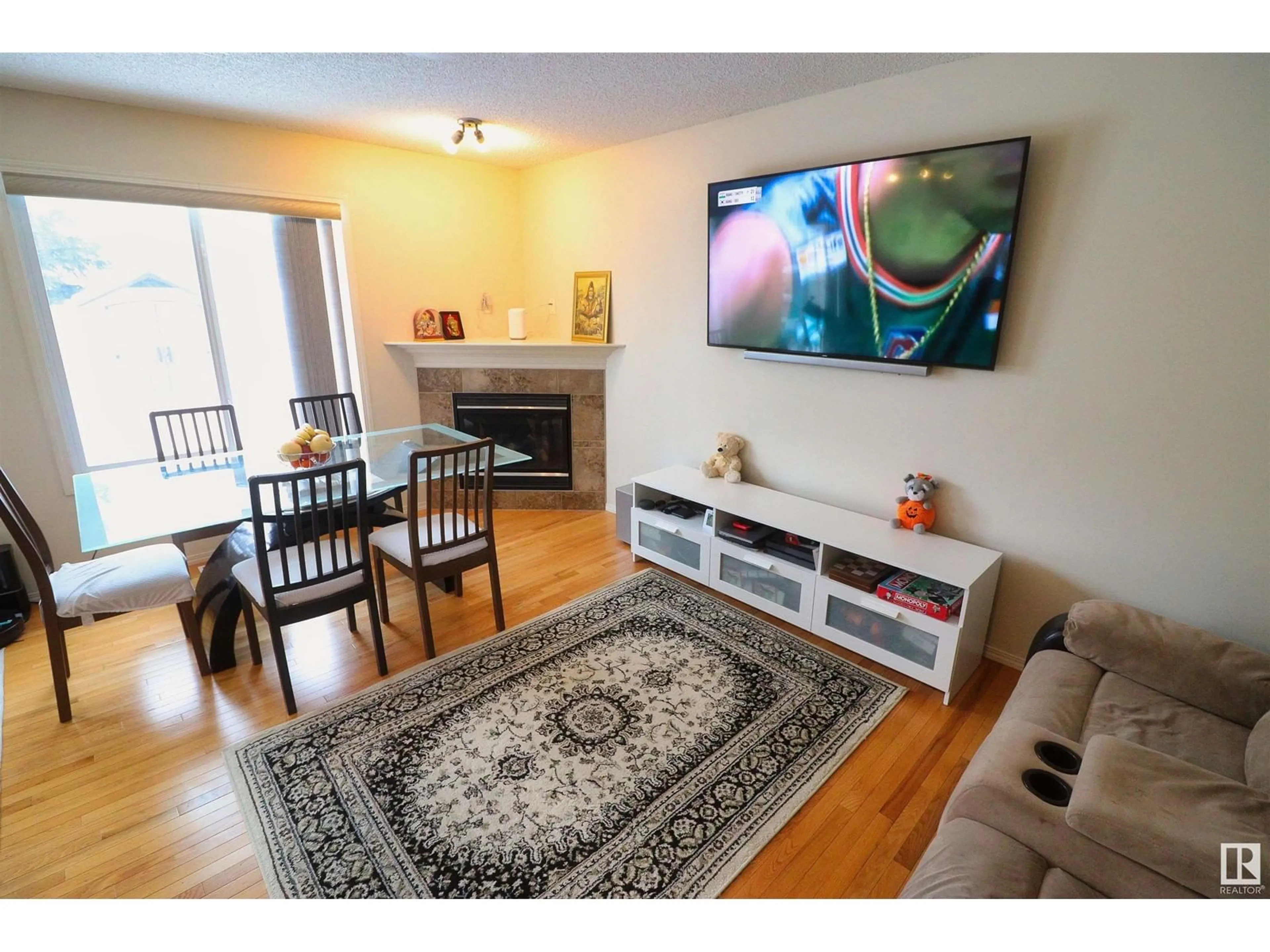 Living room with furniture, wood/laminate floor for 2311 LEMIEUX PL NW, Edmonton Alberta T6R0C2