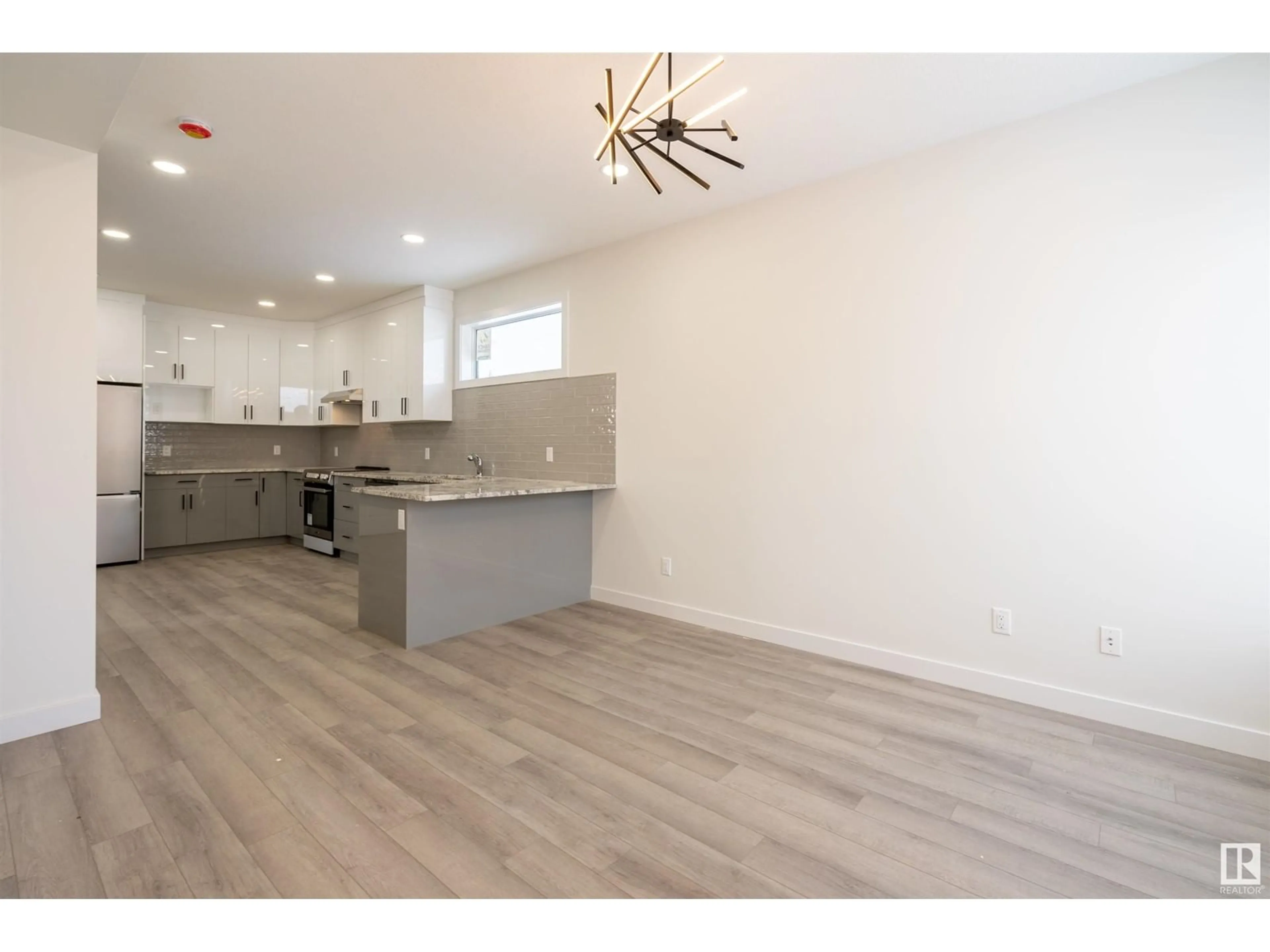 Open concept kitchen, wood/laminate floor for 10446 142 ST NW, Edmonton Alberta T5N2P2