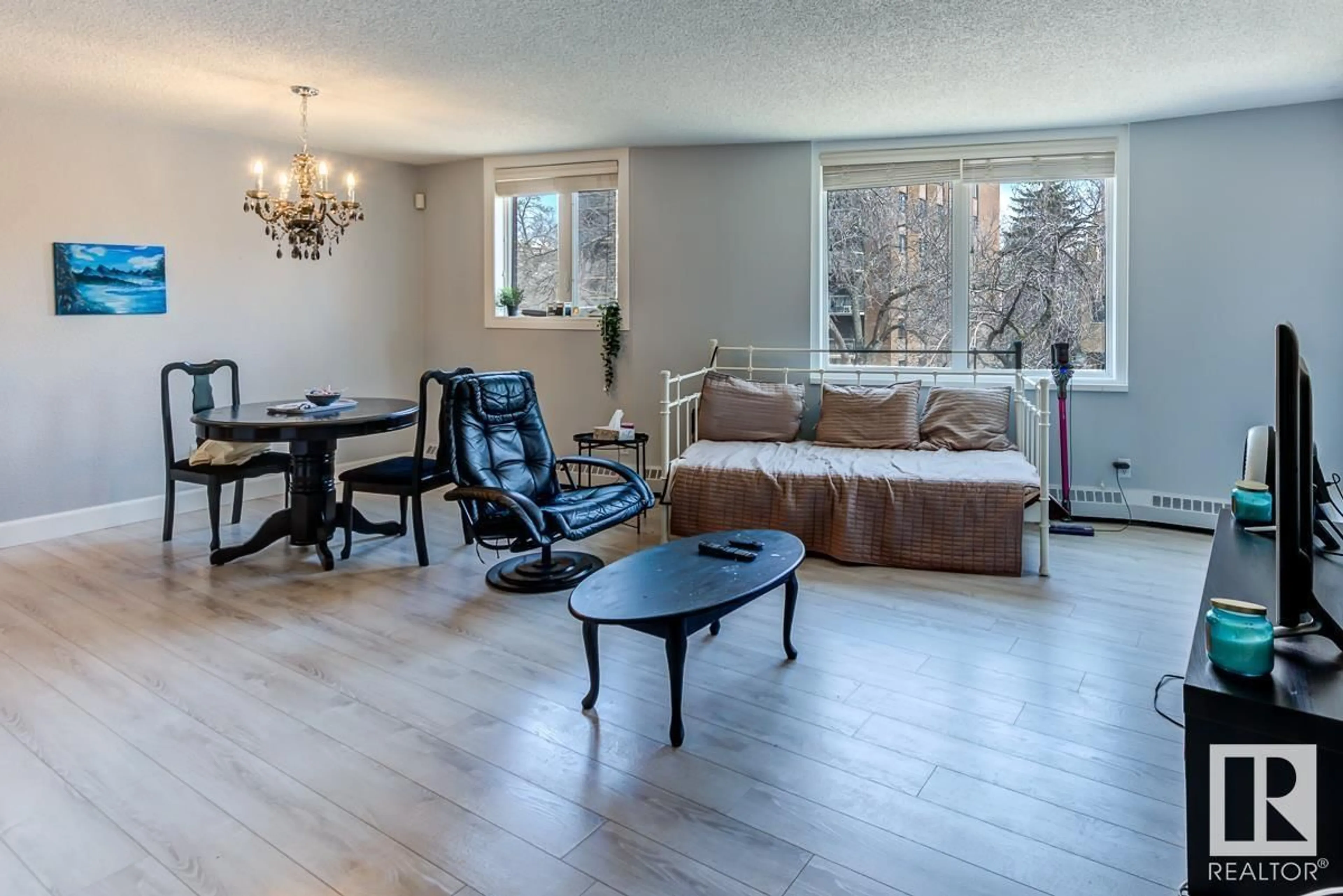 Living room with furniture, wood/laminate floor for #302 9916 113 ST NW, Edmonton Alberta T5K2N3