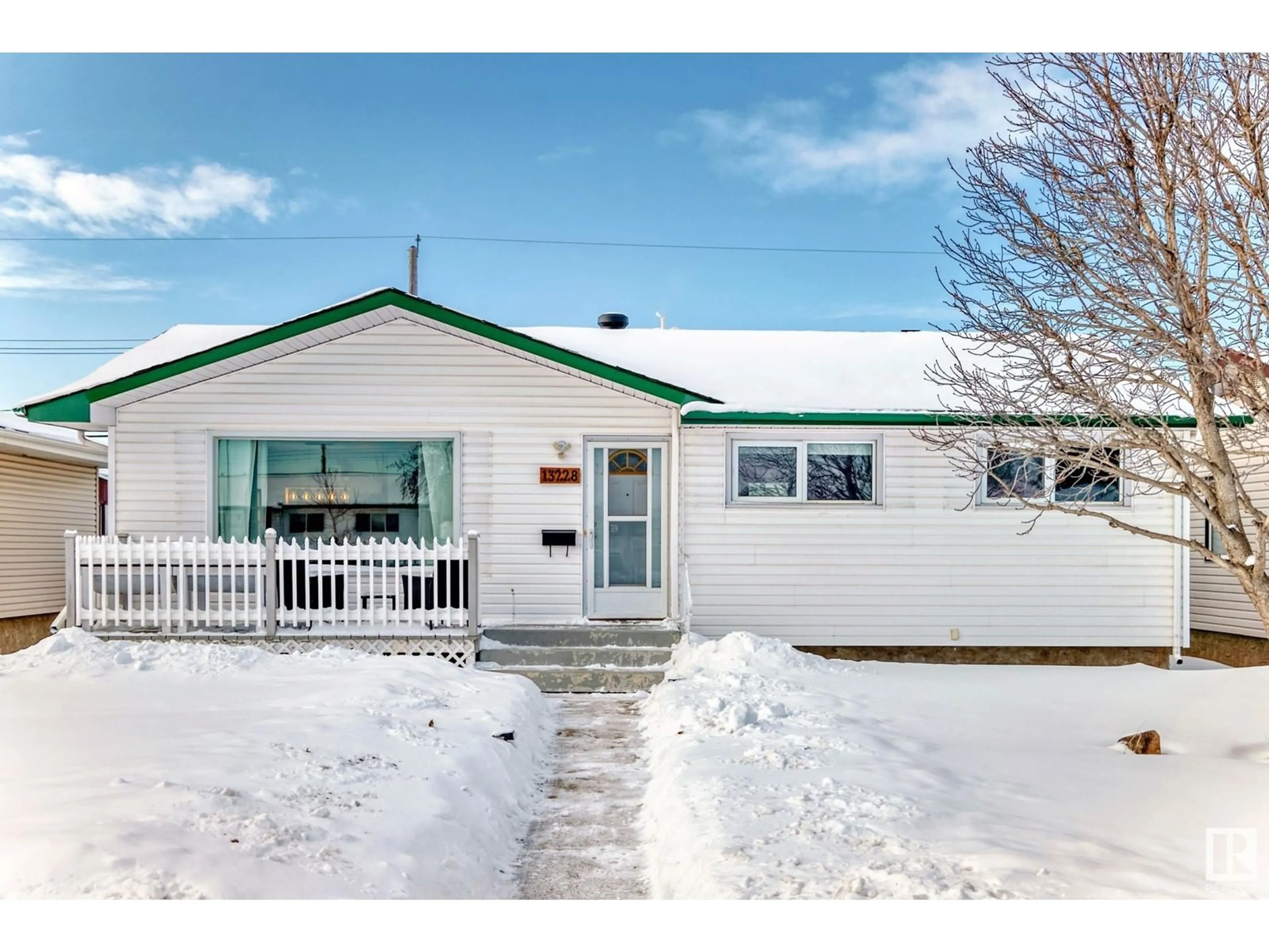 Home with vinyl exterior material, street for 13228 68 ST NW, Edmonton Alberta T5C0G3