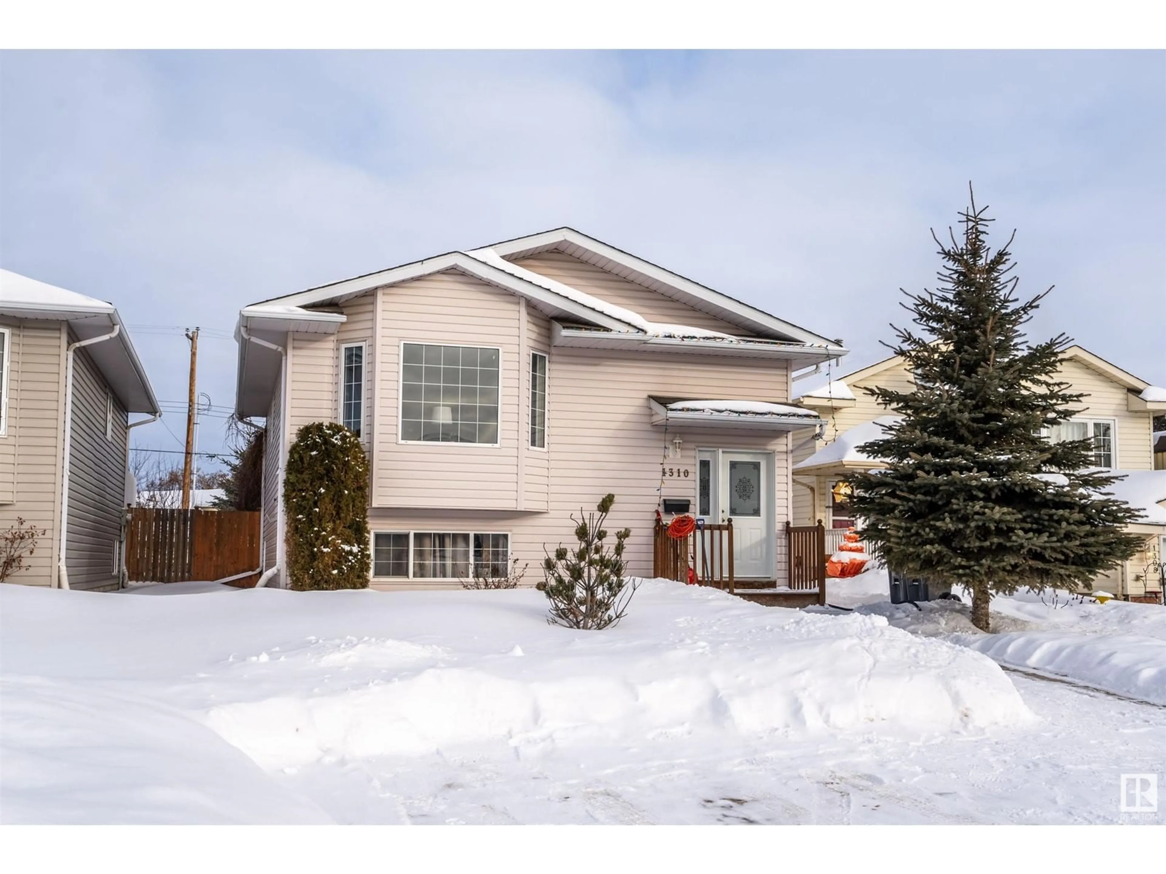 Home with vinyl exterior material, street for 1310 8 AV, Cold Lake Alberta T9M1N6