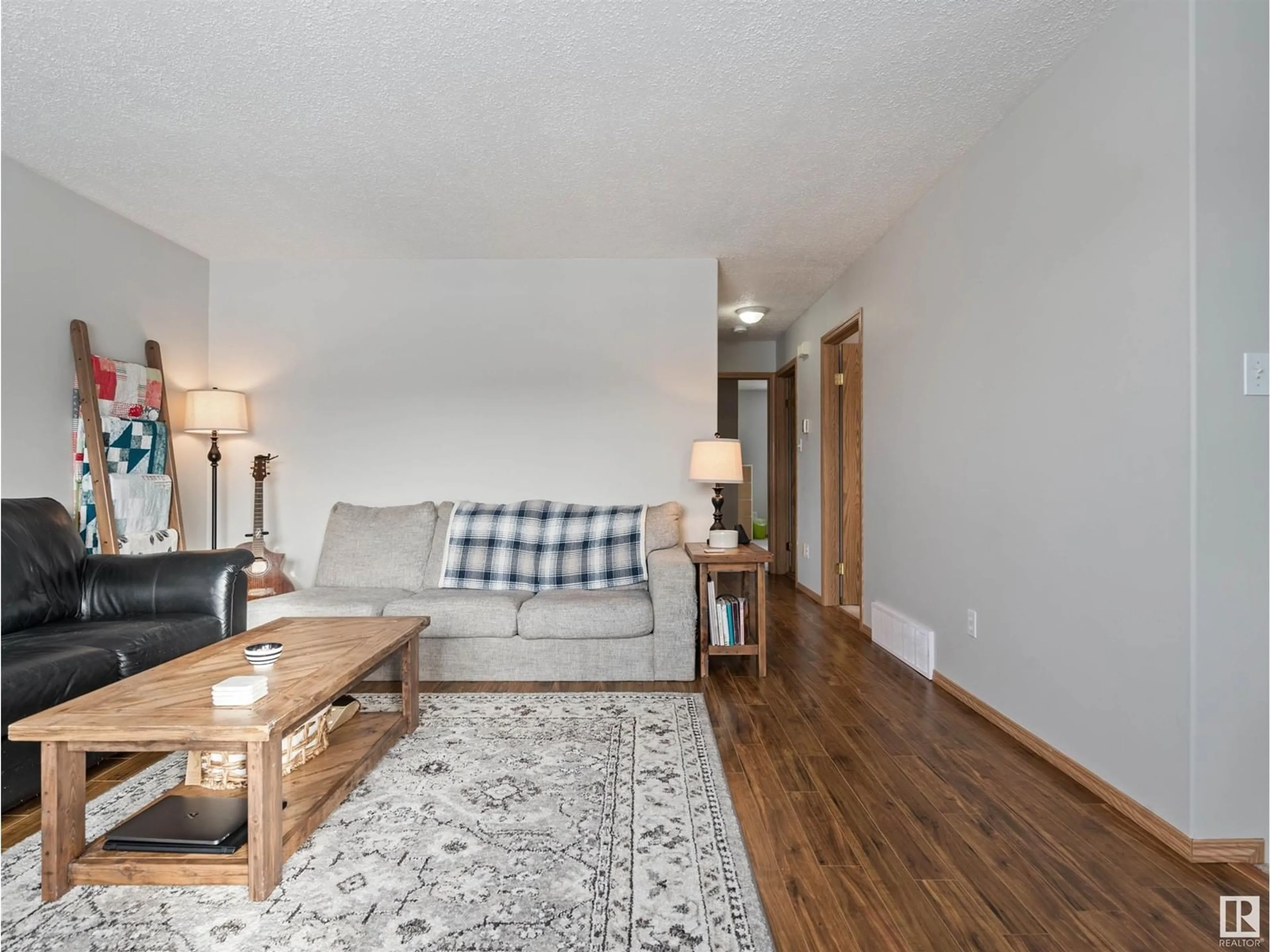 Living room with furniture, wood/laminate floor for 1310 8 AV, Cold Lake Alberta T9M1N6