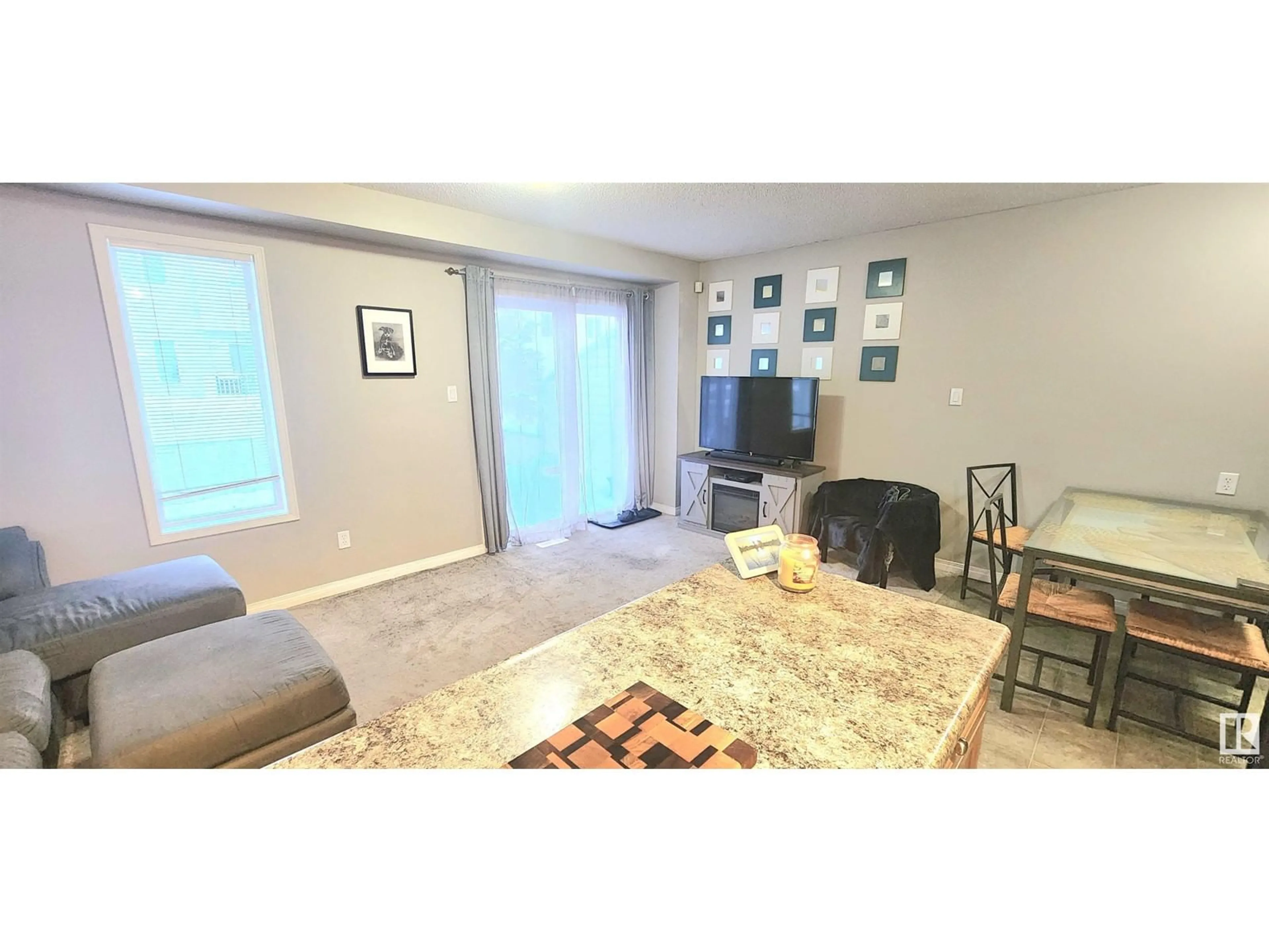 Living room with furniture, unknown for #34 130 HYNDMAN CR NW, Edmonton Alberta T5A0E8