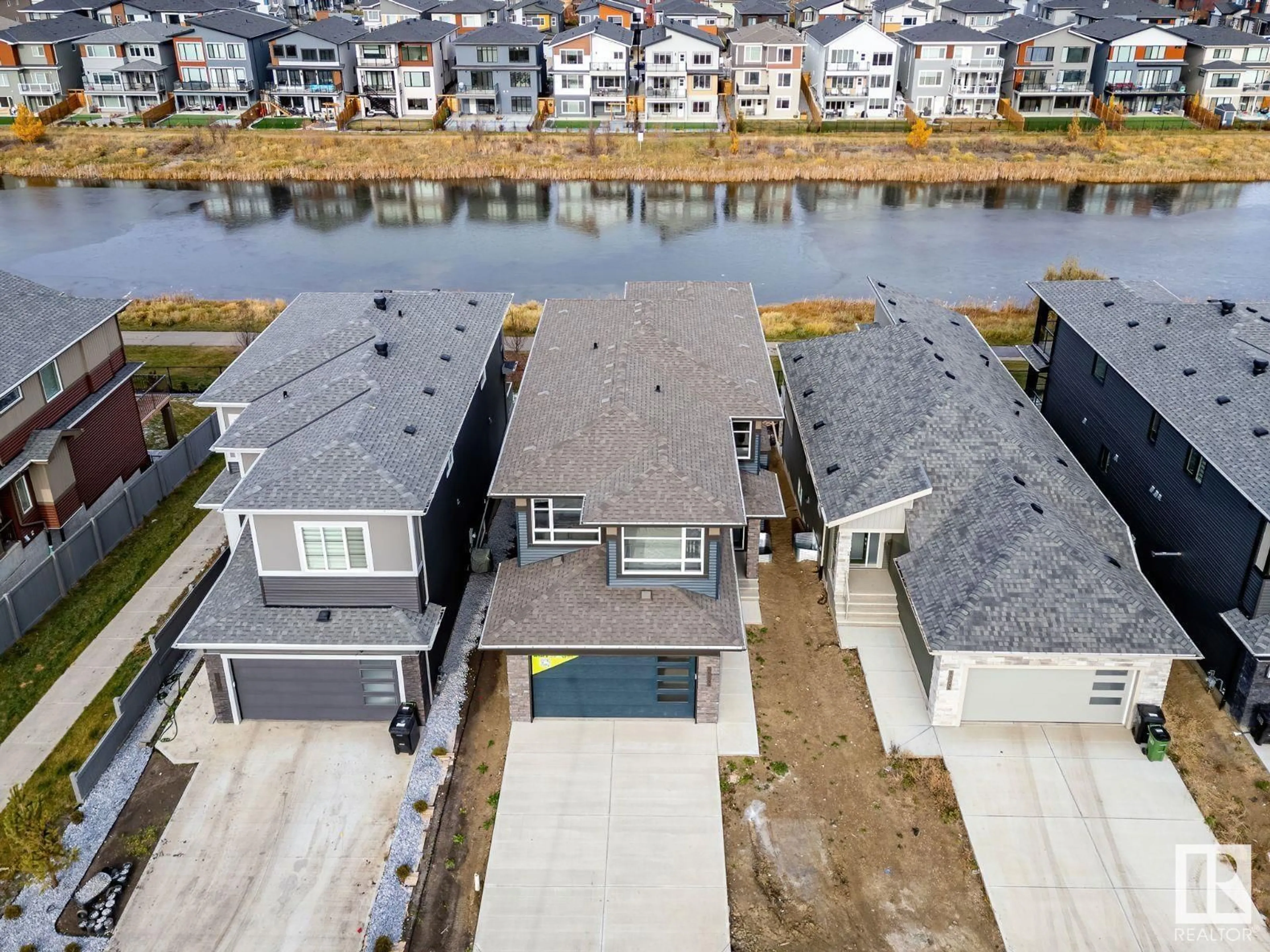 A pic from outside/outdoor area/front of a property/back of a property/a pic from drone, water/lake/river/ocean view for 5525 KOOTOOK RD SW, Edmonton Alberta T6W1A5