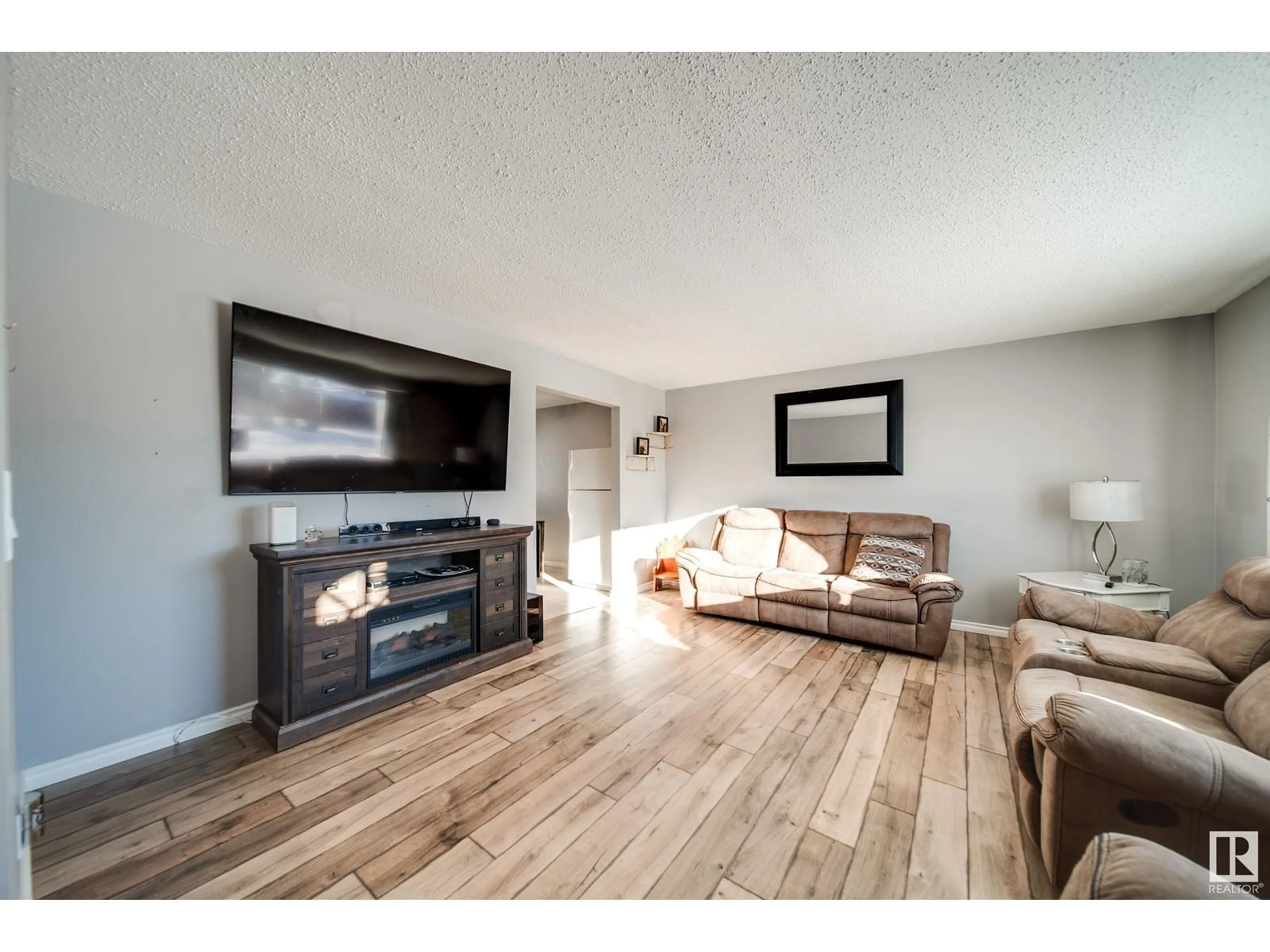 Living room with furniture, wood/laminate floor for 5408 51 ST, Gibbons Alberta T0A1N0