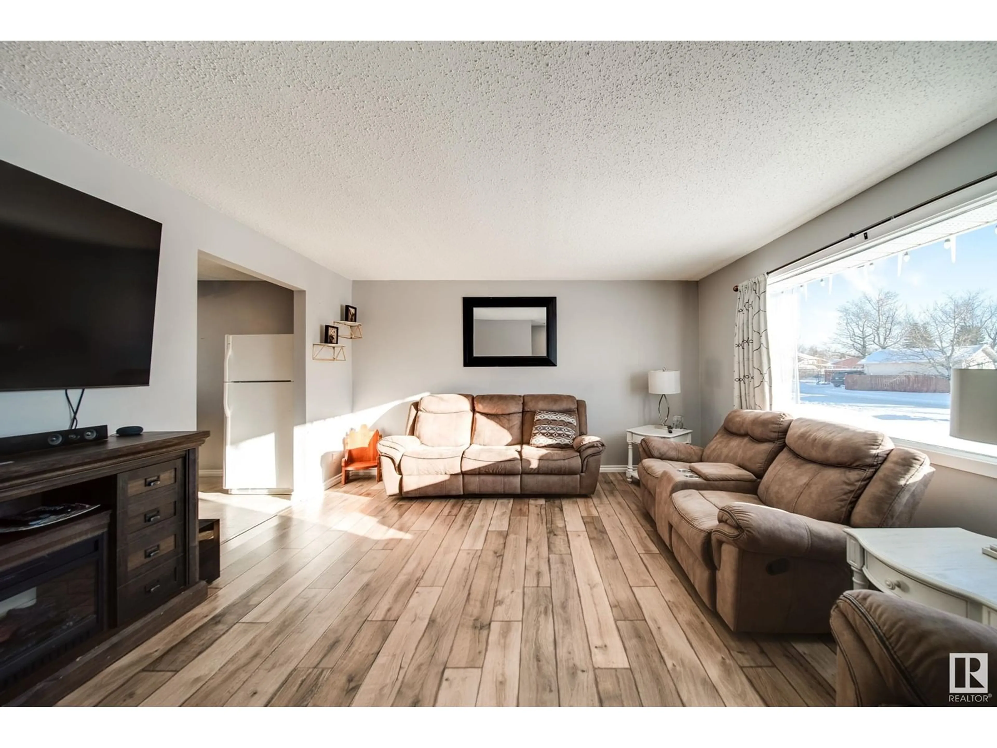 Living room with furniture, wood/laminate floor for 5408 51 ST, Gibbons Alberta T0A1N0