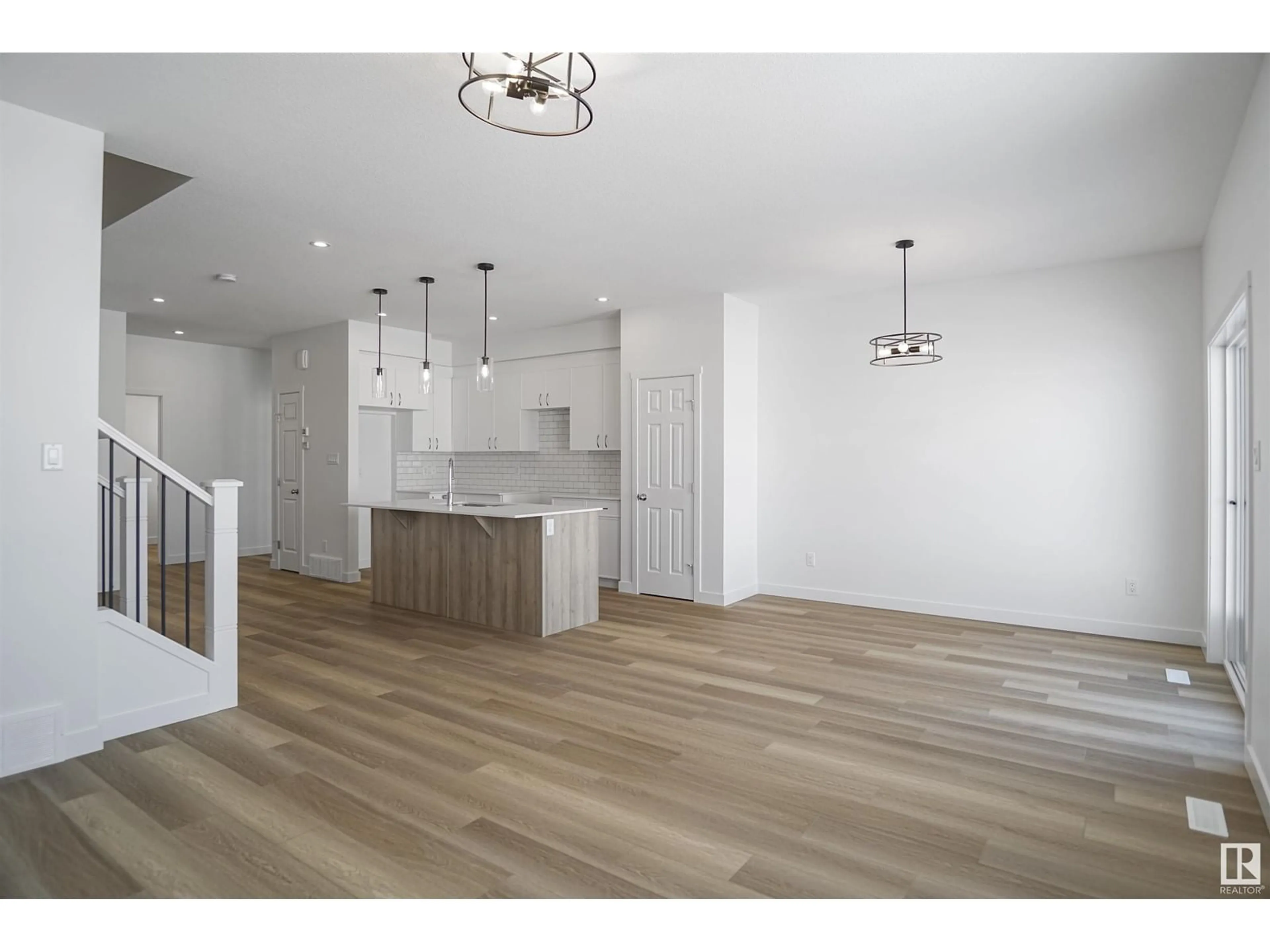 Open concept kitchen, wood/laminate floor for 4628 177 AV NW, Edmonton Alberta T5Y4G4