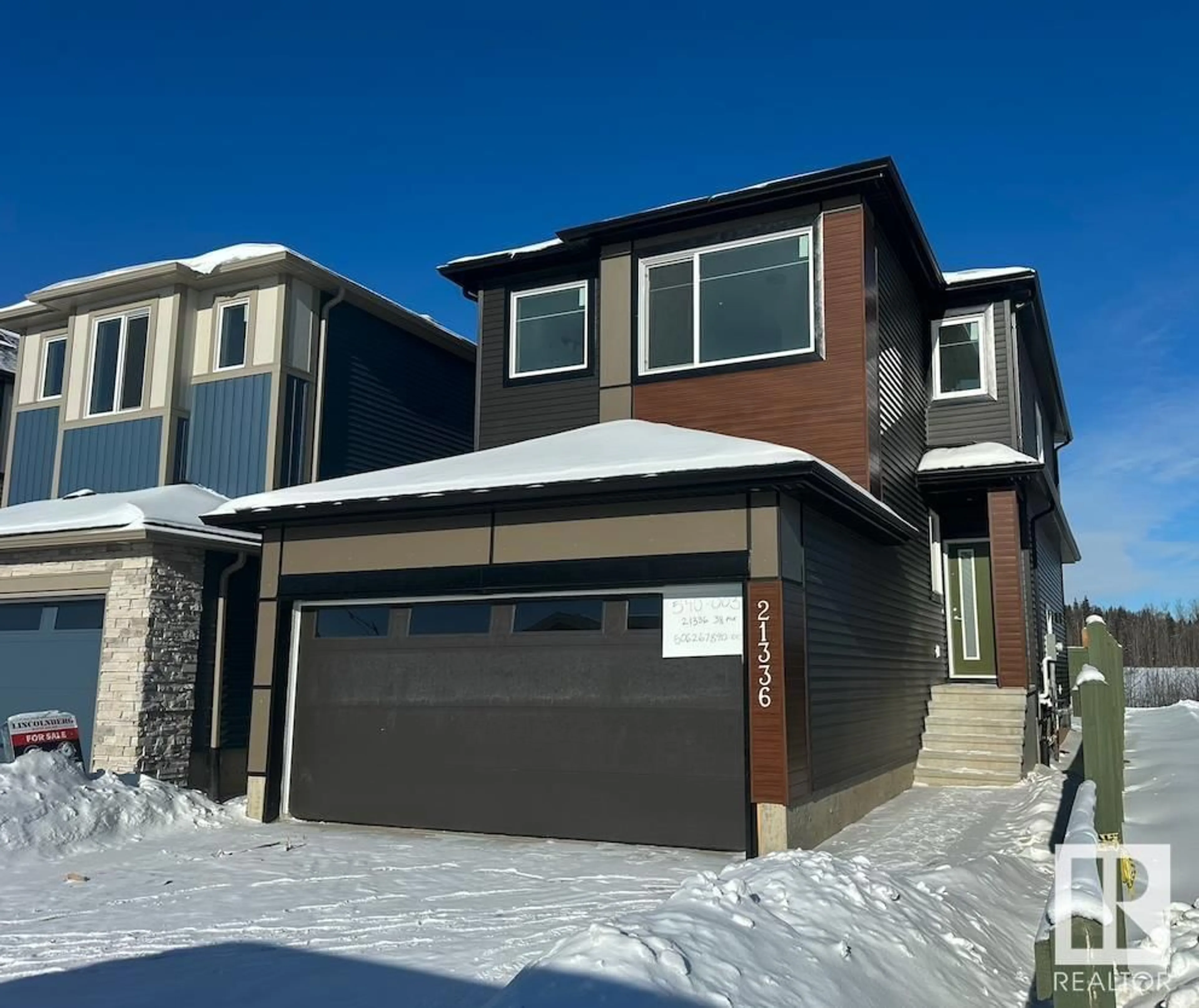 Home with vinyl exterior material, street for 21336 38 AV NW, Edmonton Alberta T6M1S4