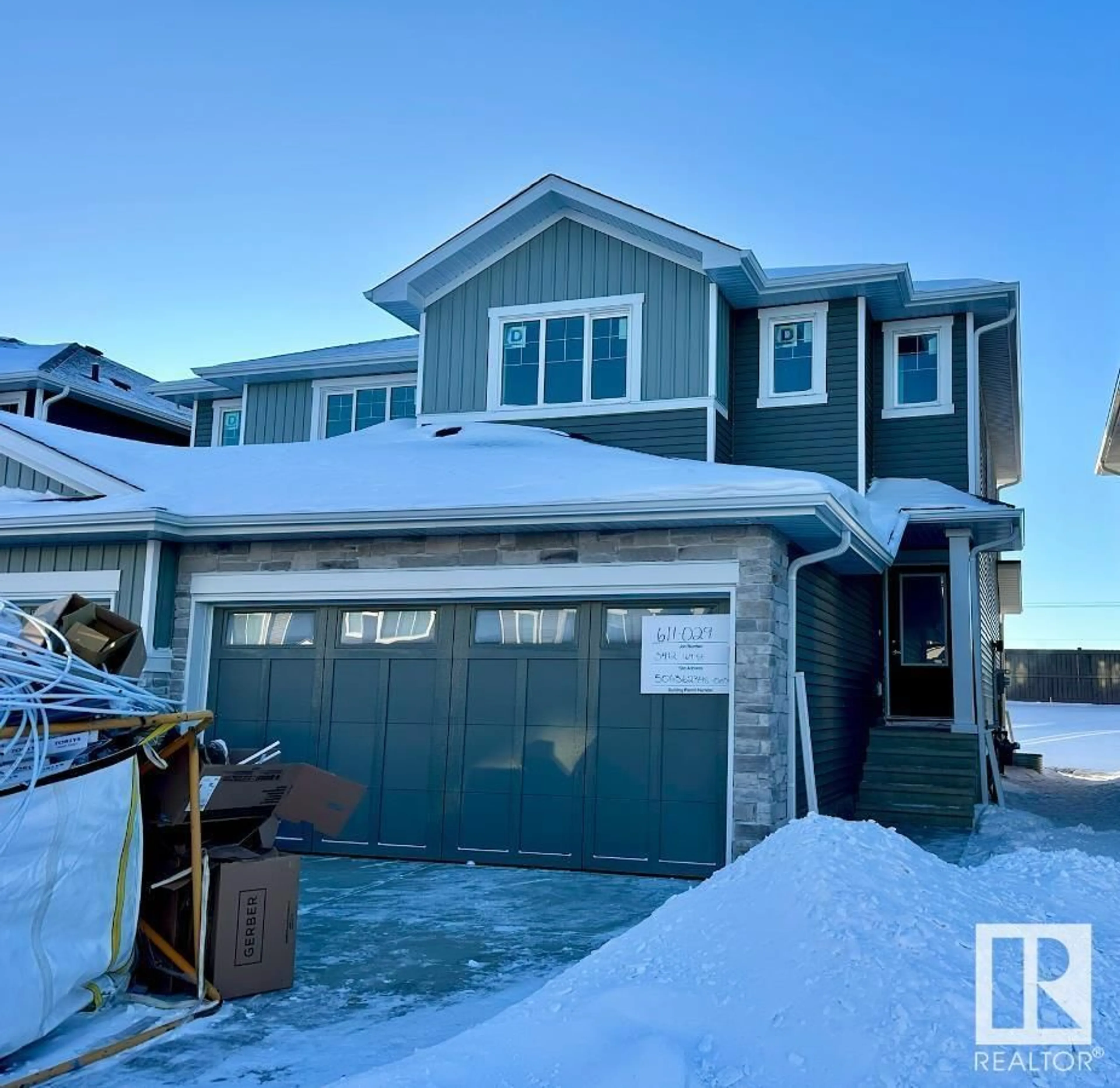 Home with vinyl exterior material, street for 3412 169 ST SW, Edmonton Alberta T6W5M4