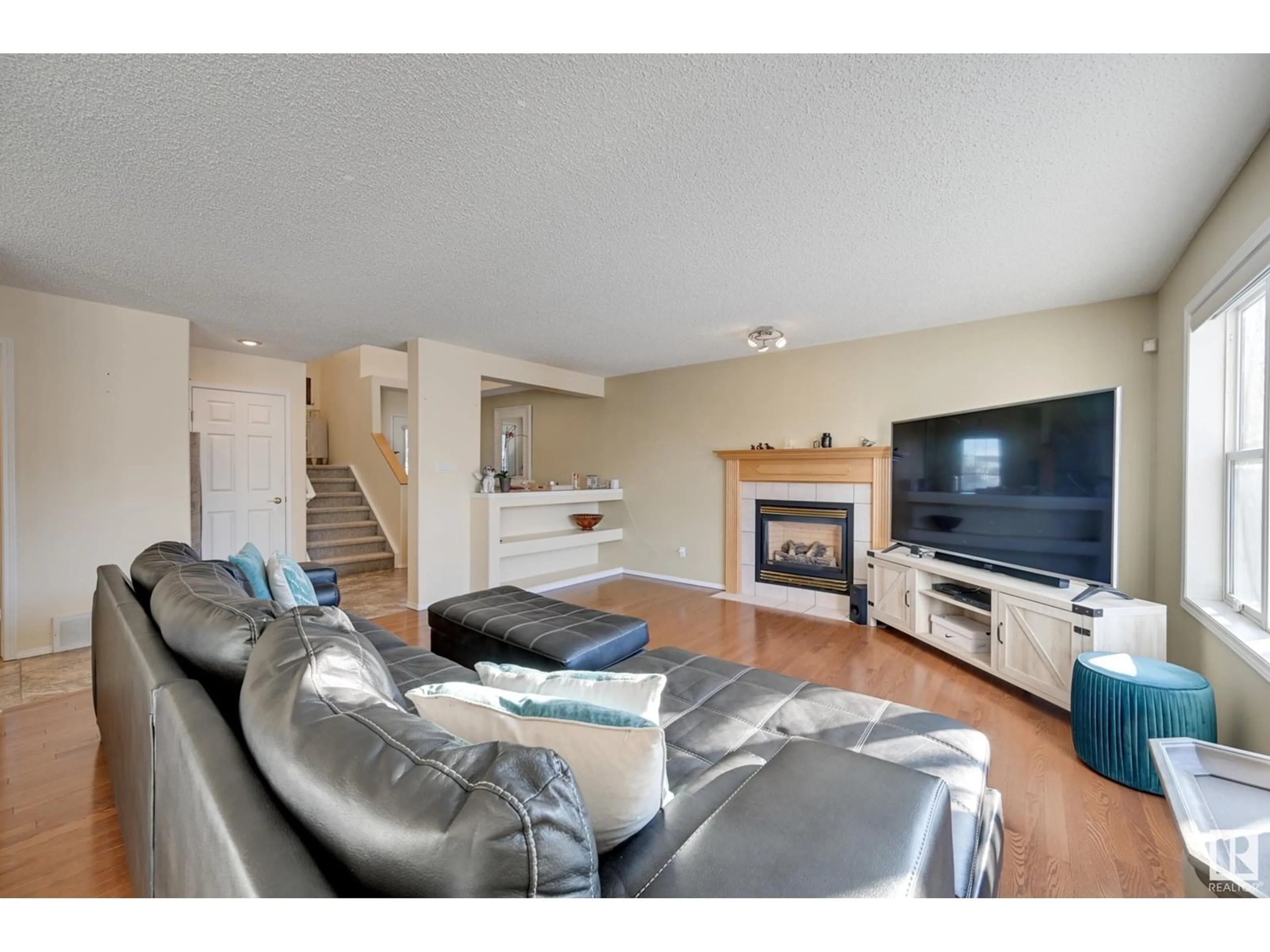 Living room with furniture, wood/laminate floor for NW - 5146 190A ST, Edmonton Alberta T6M2R5