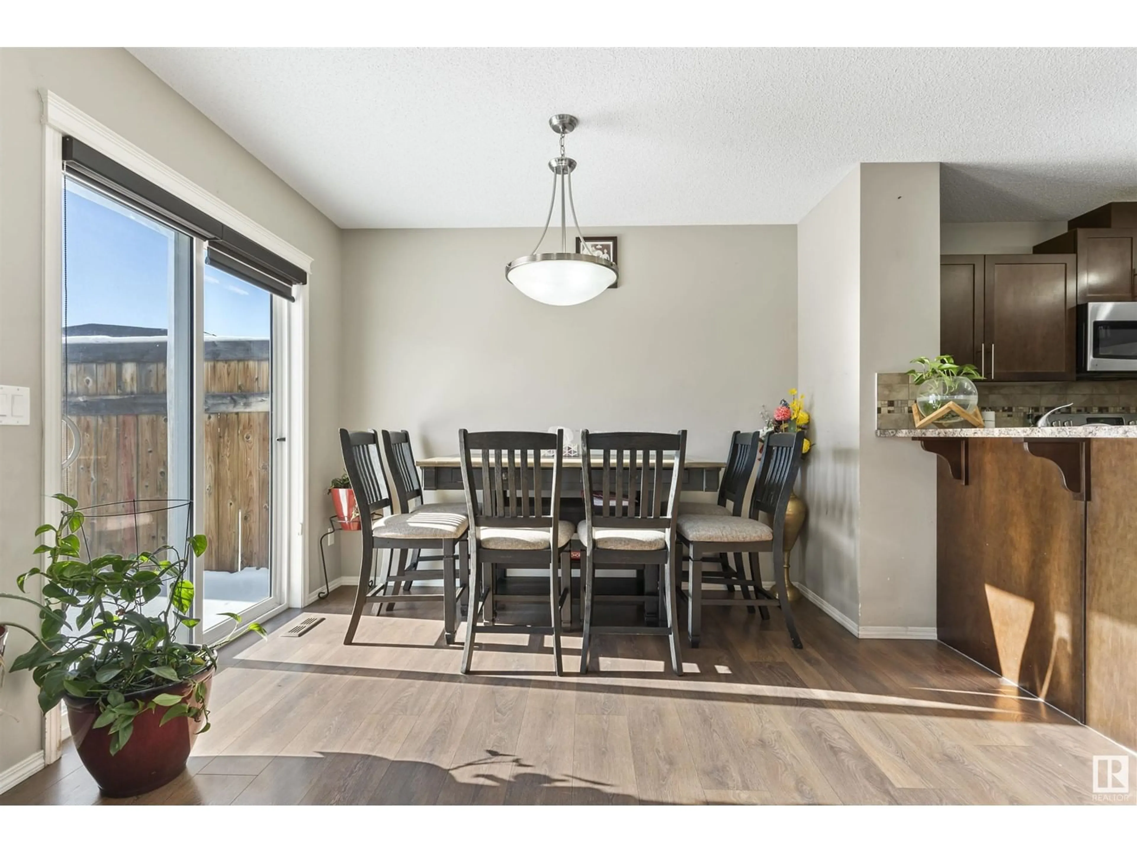 Dining room, wood/laminate floor for 3359 14 AV NW, Edmonton Alberta T6T0X3