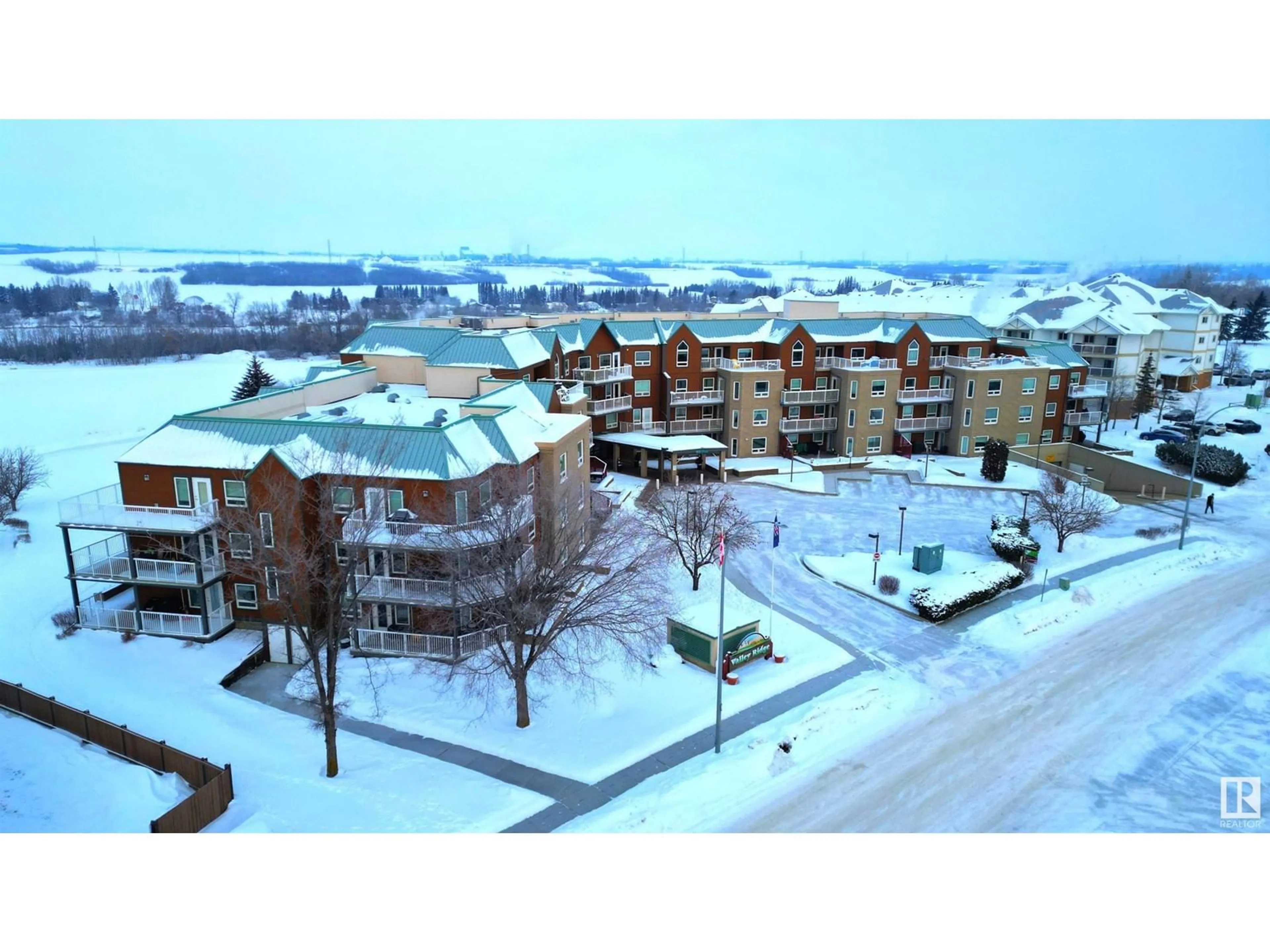 A pic from outside/outdoor area/front of a property/back of a property/a pic from drone, unknown for #404 9926 100 AV, Fort Saskatchewan Alberta T8L4E3