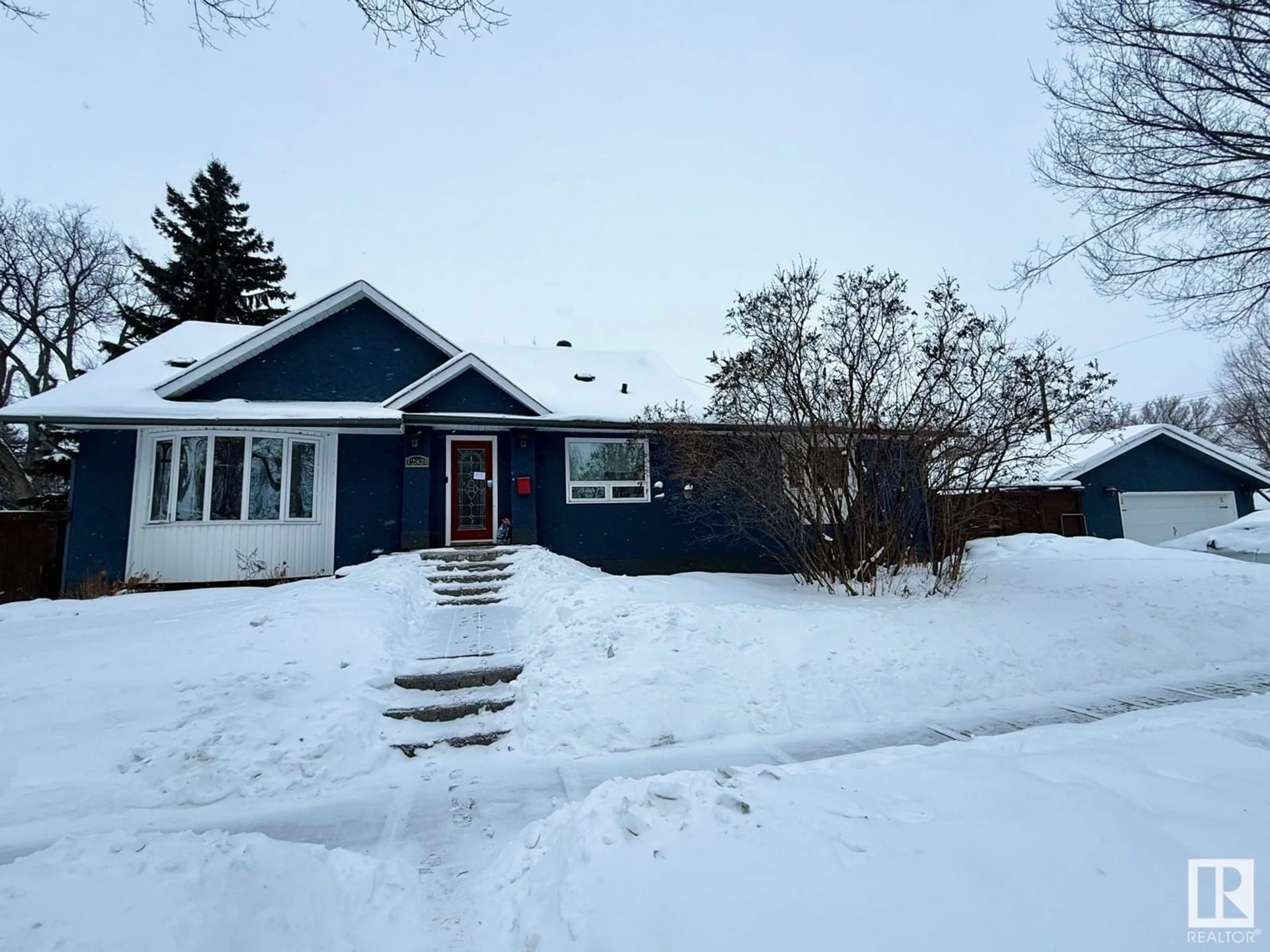 A pic from outside/outdoor area/front of a property/back of a property/a pic from drone, street for 12824 121 AV NW, Edmonton Alberta T5L2S7