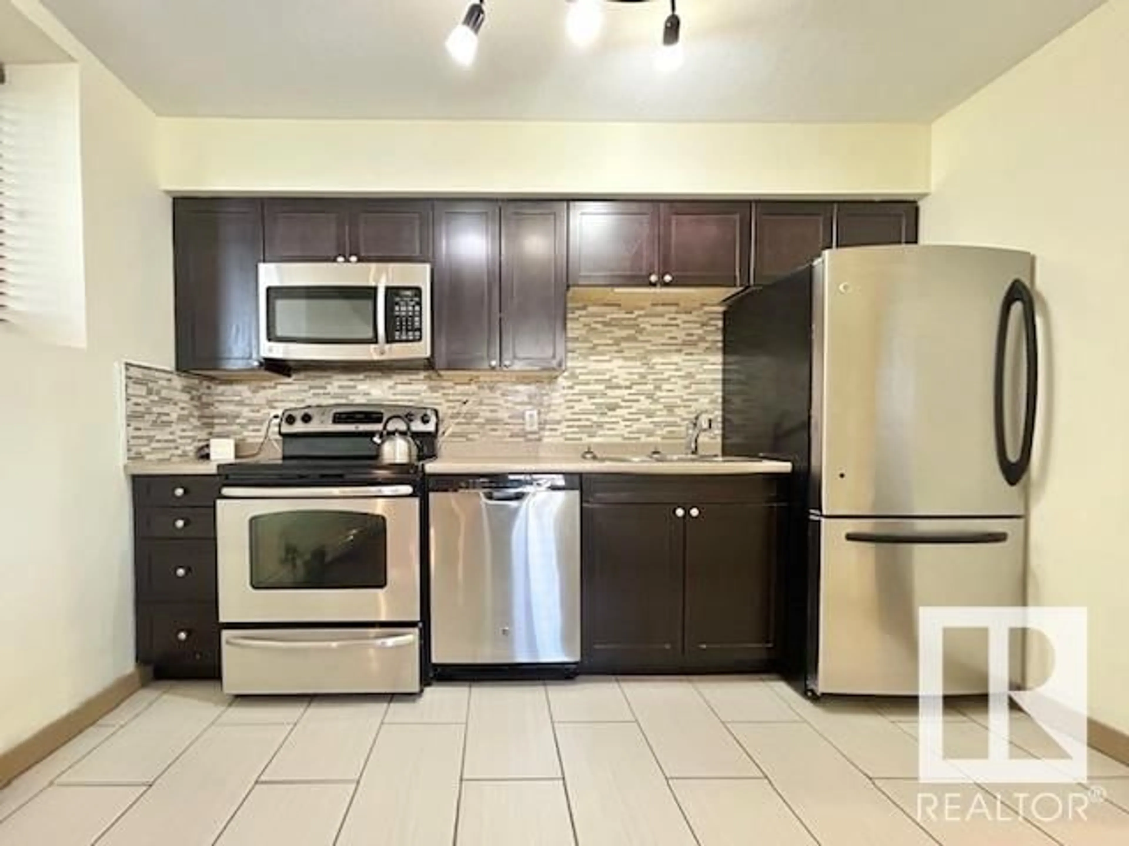 Standard kitchen, ceramic/tile floor for #101 7111 80 AV NW, Edmonton Alberta T6B0C7