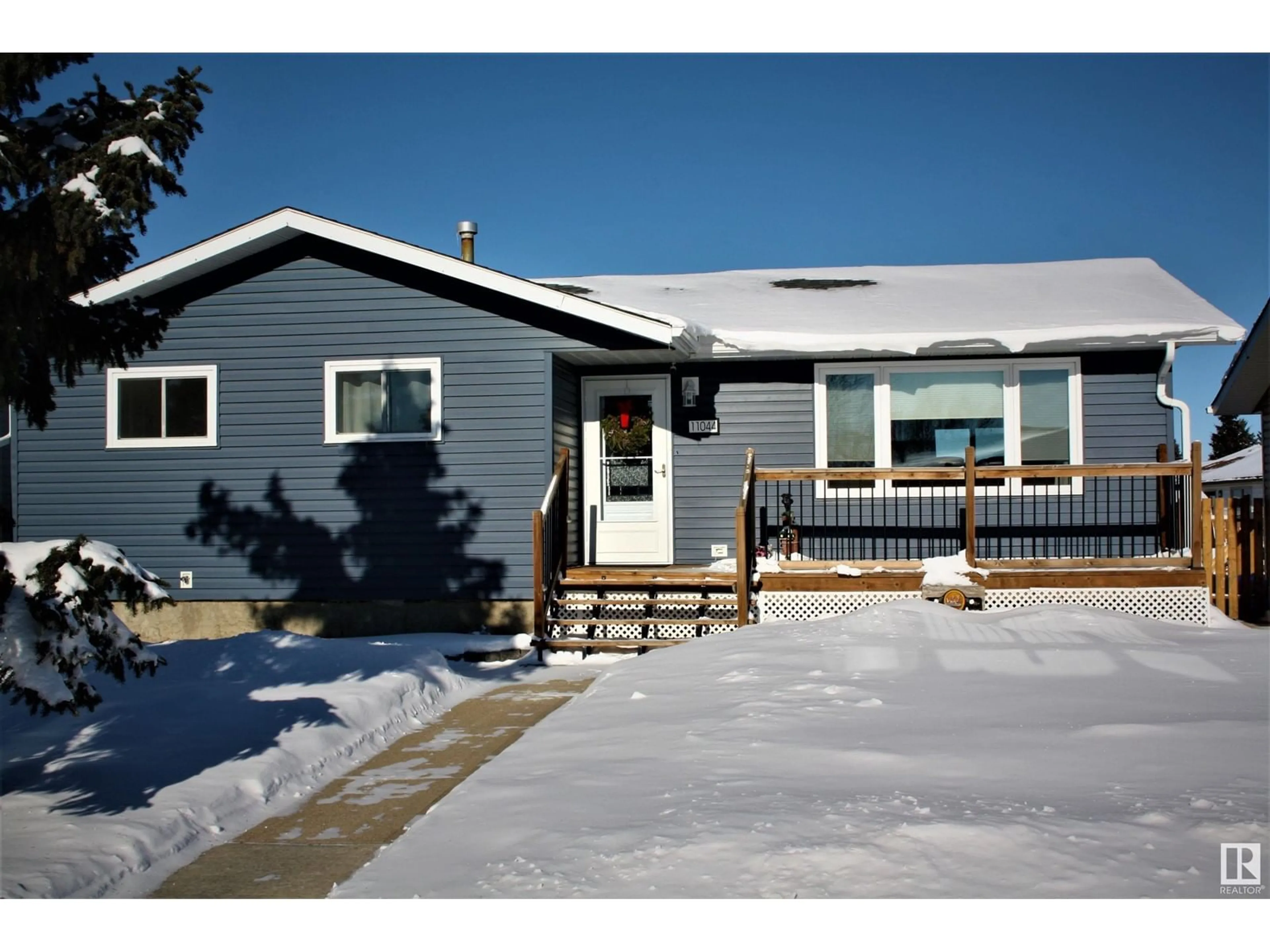 Home with vinyl exterior material, street for 11044 104 St, Westlock Alberta T7P1G4