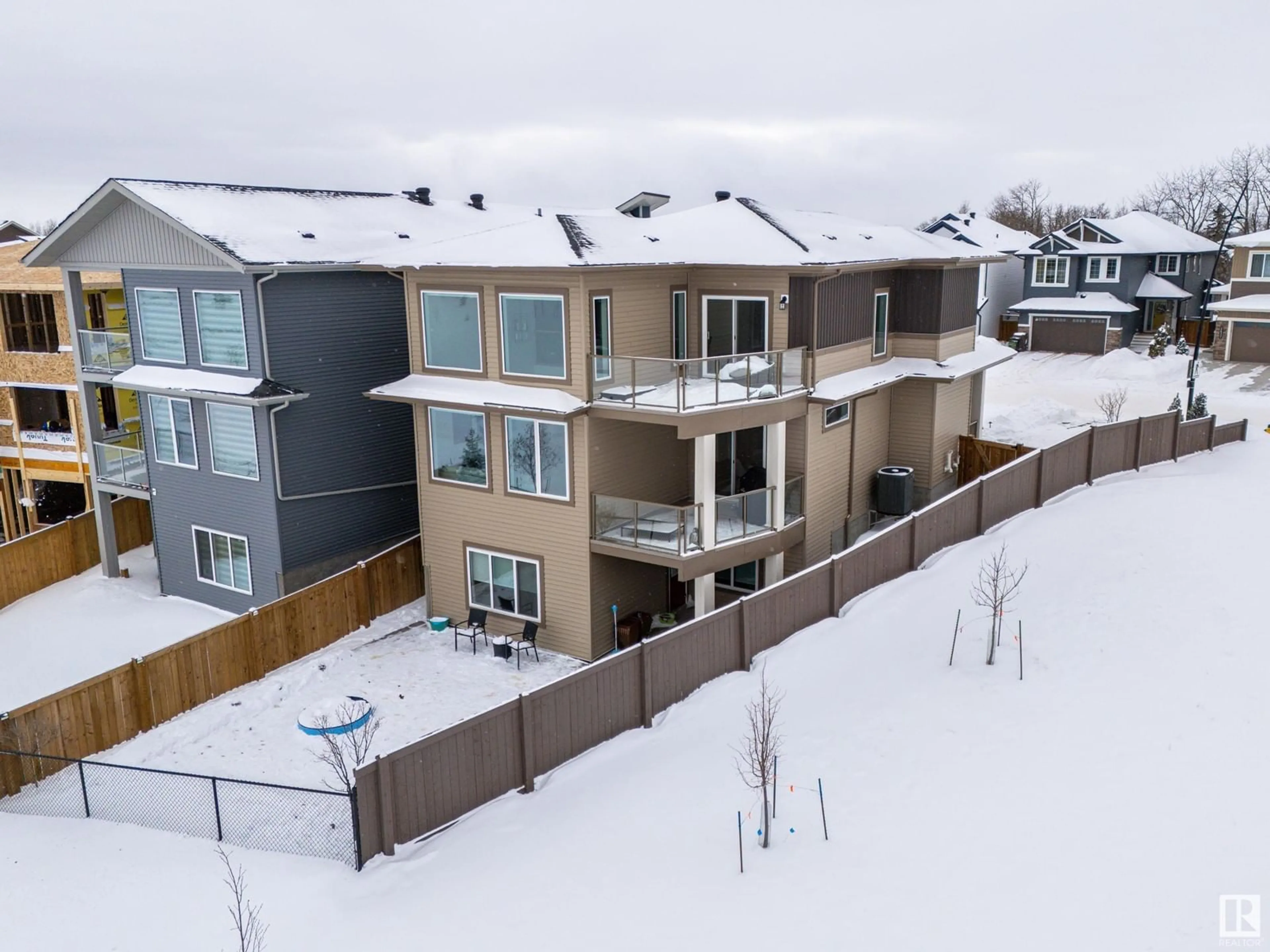 A pic from outside/outdoor area/front of a property/back of a property/a pic from drone, mountain view for 2619 208 ST NW, Edmonton Alberta T6M1P3