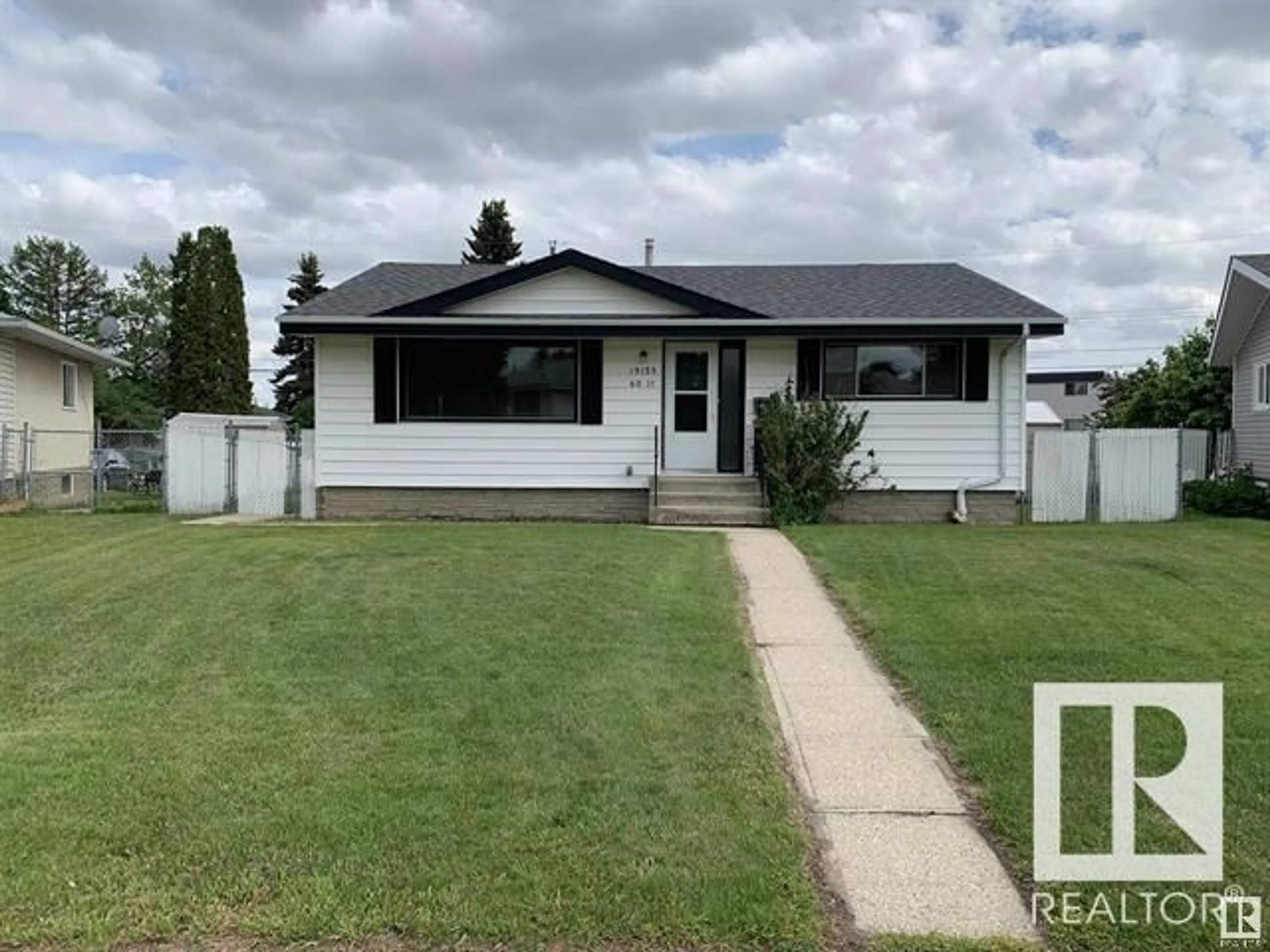 Home with vinyl exterior material, street for 13123 60 ST NW, Edmonton Alberta T5A0S2