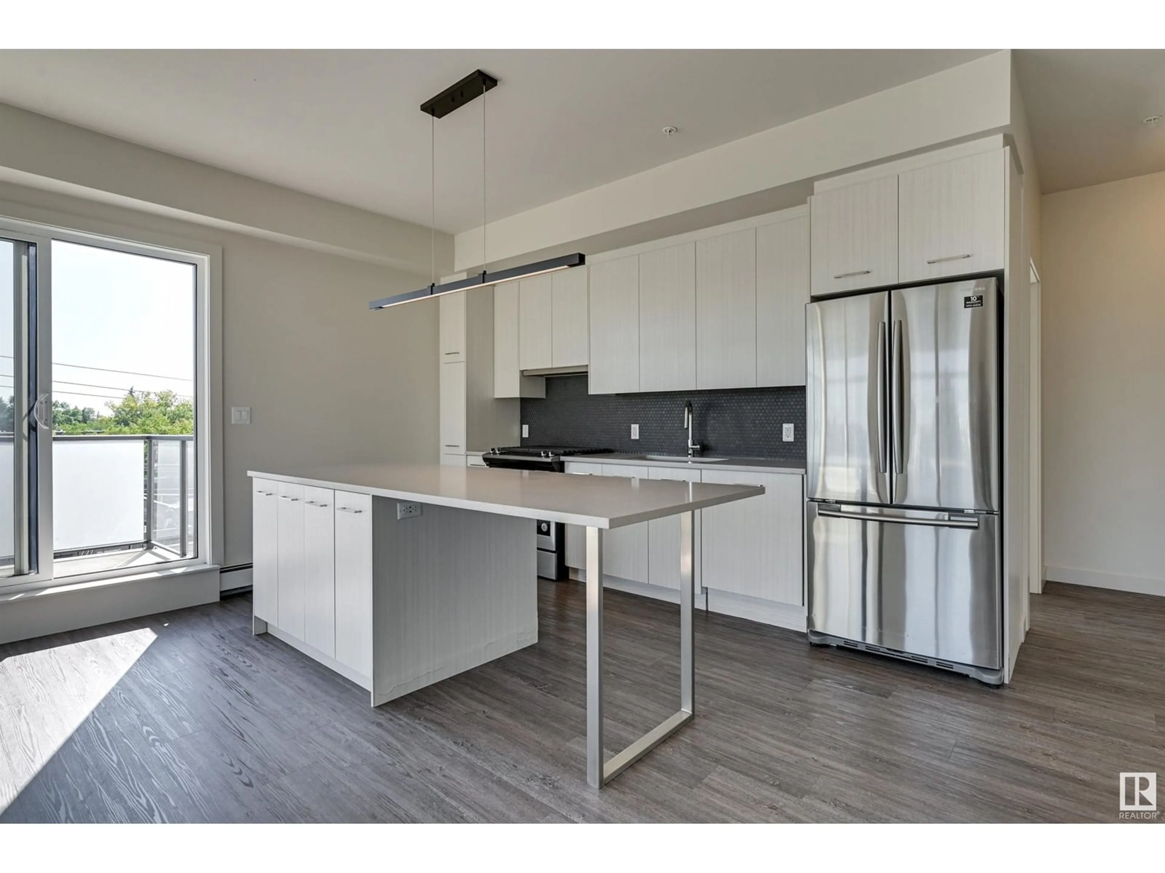 Open concept kitchen, wood/laminate floor for #403 10837 83 AV NW, Edmonton Alberta T6E2E6